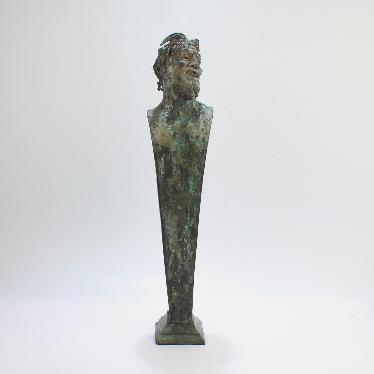 A wonderful Grand Tour period bronze Herm after an ancient model.

Depicting Bacchus (or possibly a Faun).

Having an exceptional weathered, verdigris patina. 

The bronze was found in a Pennsylvania estate and was (by repute) periodically kept