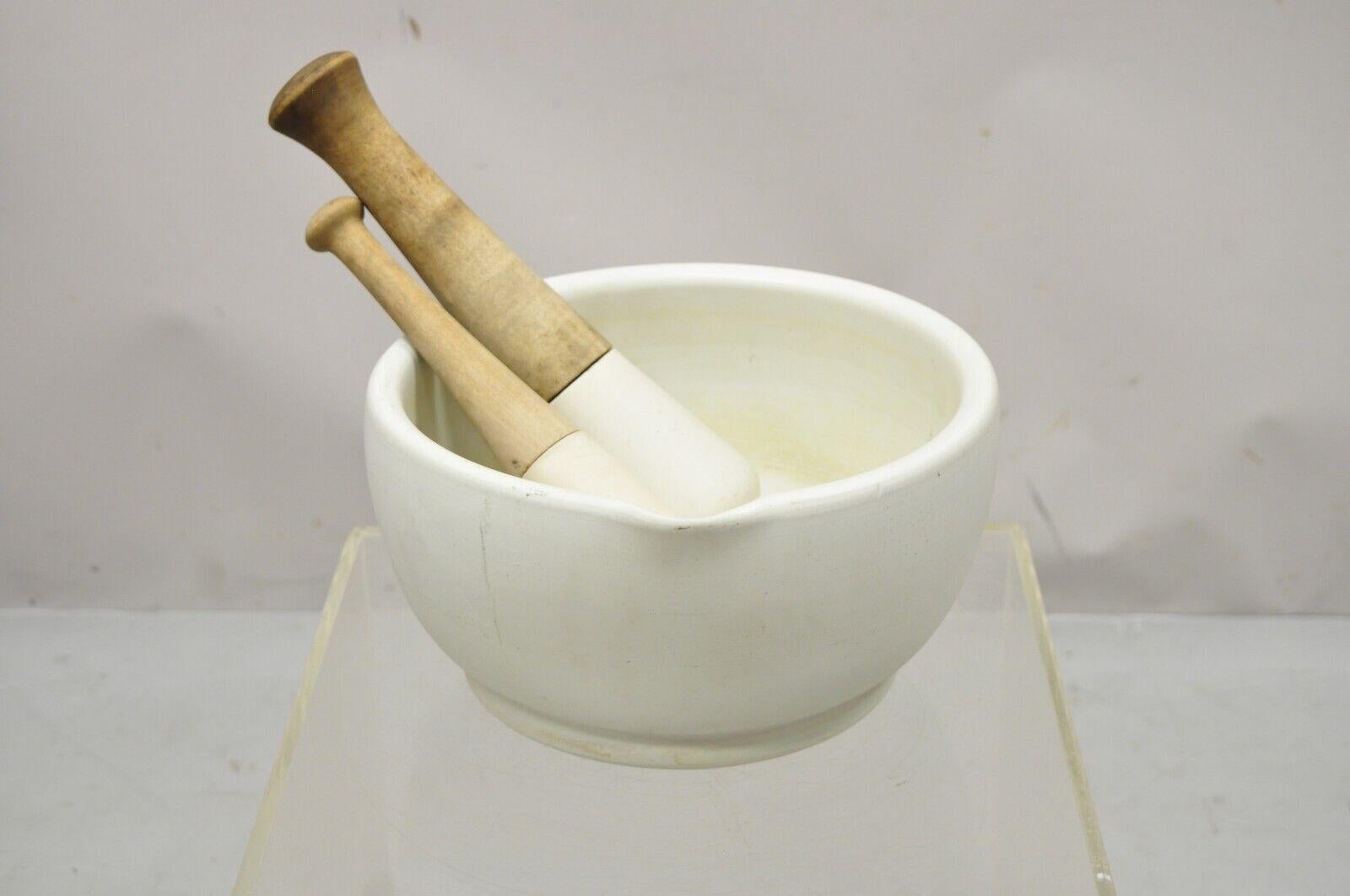 Antique granite marble & wood mortar & pestle bowlApothecary attributed to Thomas Maddock & Sons. Item features solid marble/granite bowl, (2) sizes of pestle with solid wood handles, bowl with carved spout, very nice antique set, quality