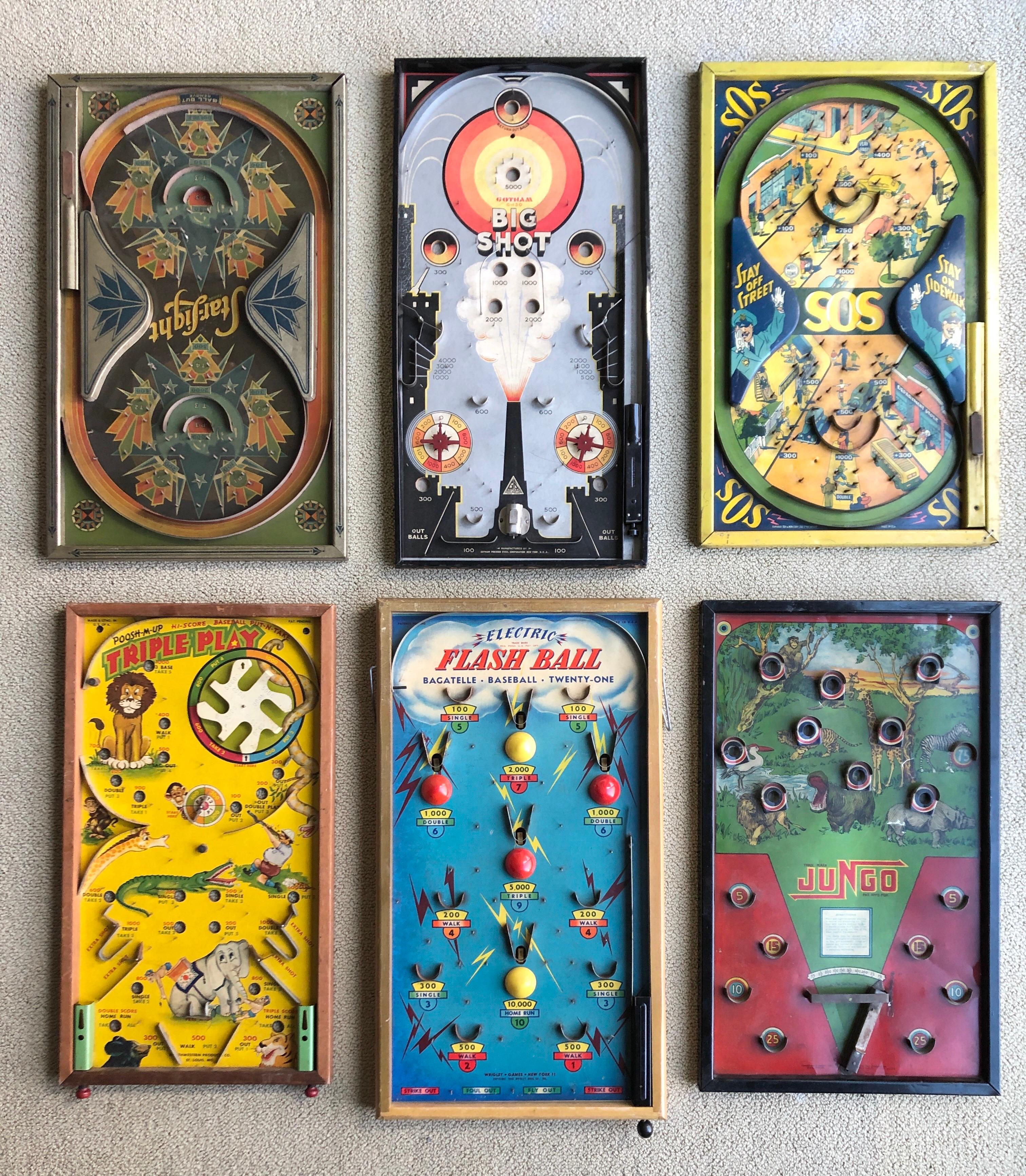 A collection of 6 antique colorful tabletop pinball games circa 1930s. Make a very graphic and colorful wall display for childs bedroom, a den or rec room. These range in 23 to 24