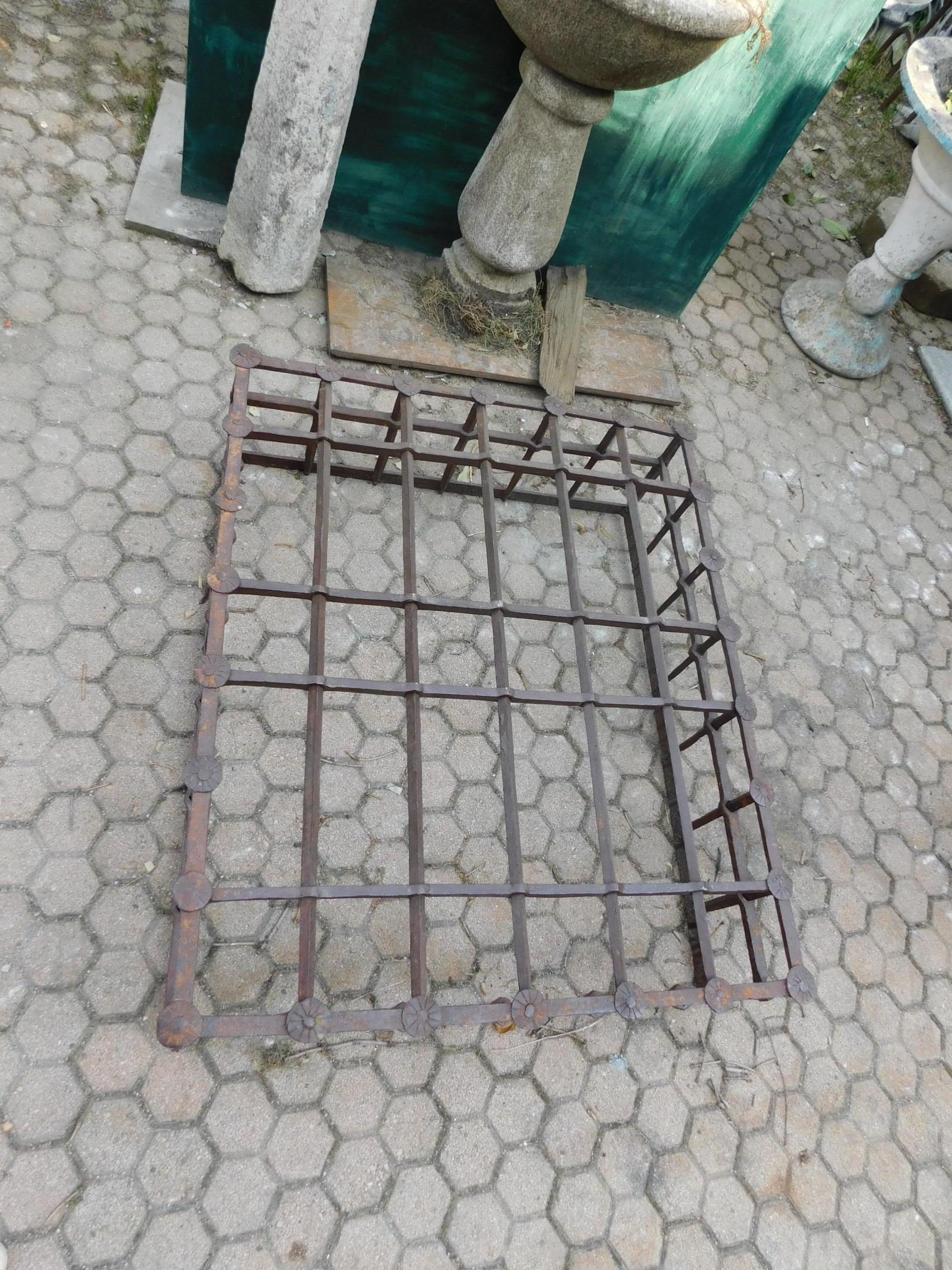 Antique iron grate for window, exhumed from a noble palace in Venice, 17th century, today can be used as a coffee table with glass on it or as a decoration for a luxurious interior, also suitable in the garden, as a base table for climbing plants or