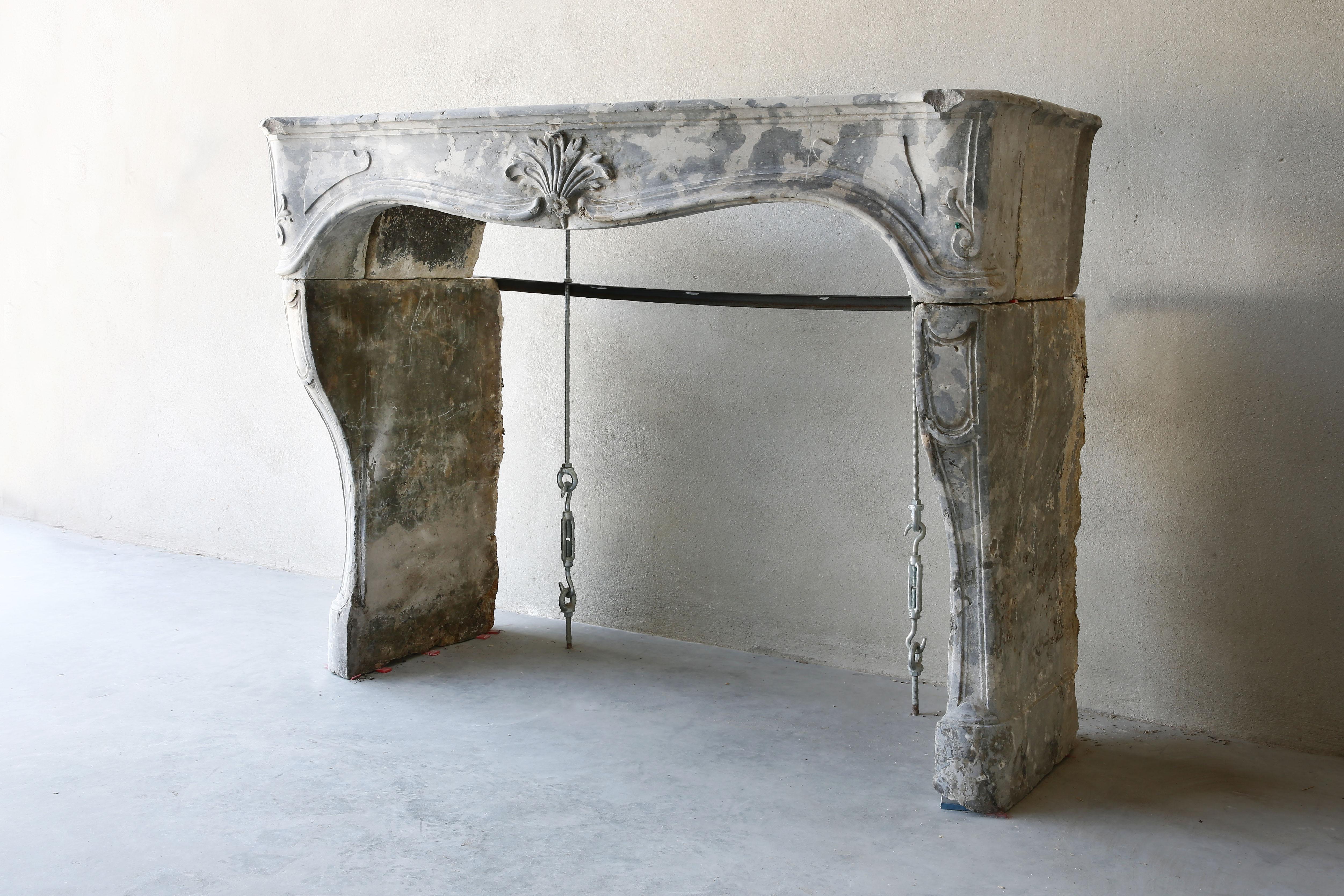 Very special marble stone fireplace by the structure and pattern from Burgundy ! This mantelpiece dates back to the 19th century and is entirely in the style of Louis XV. Recognizable by the scallop in the middle and beautiful round shapes. The