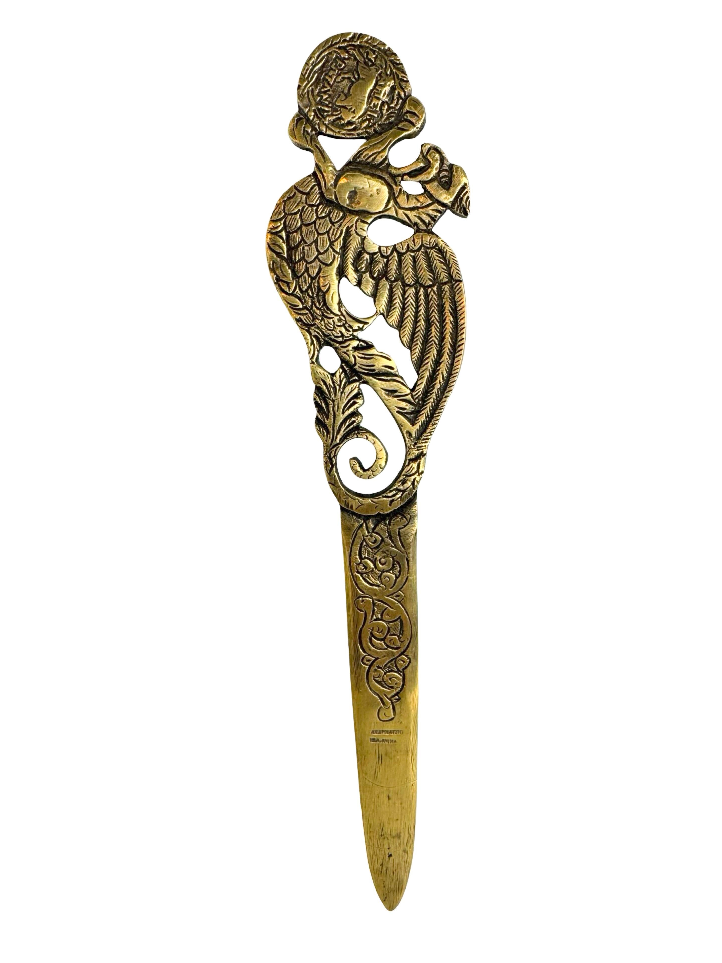 A beautiful antique bronze letter opener dating to the 1910s or earlier, crafted by an unknown sculptor, signed but can not find any information. This beautiful Art Nouveau piece displays graceful, flowing lines and subtle sculptural details