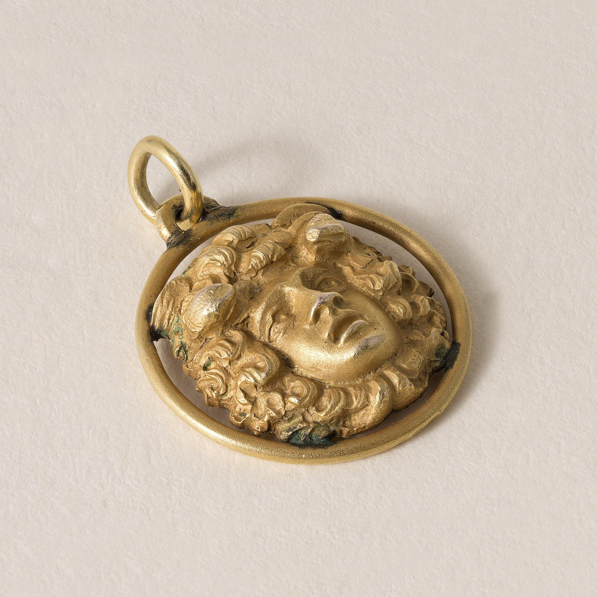 This is a gold charm pendant featuring an emotive face of Greek God Bacchus
2.9 grams
18k yellow gold
0.6 inch length
All original patina, has not been polished.