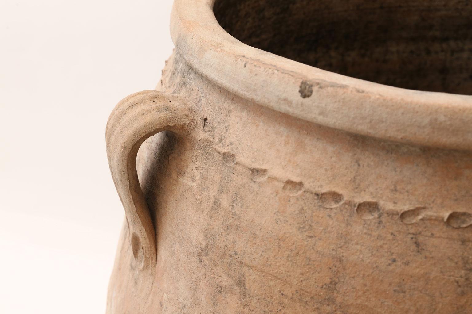 Antique Greek olive jar. Hand-sculpted ribbed amphora in terracotta, early 20th century.