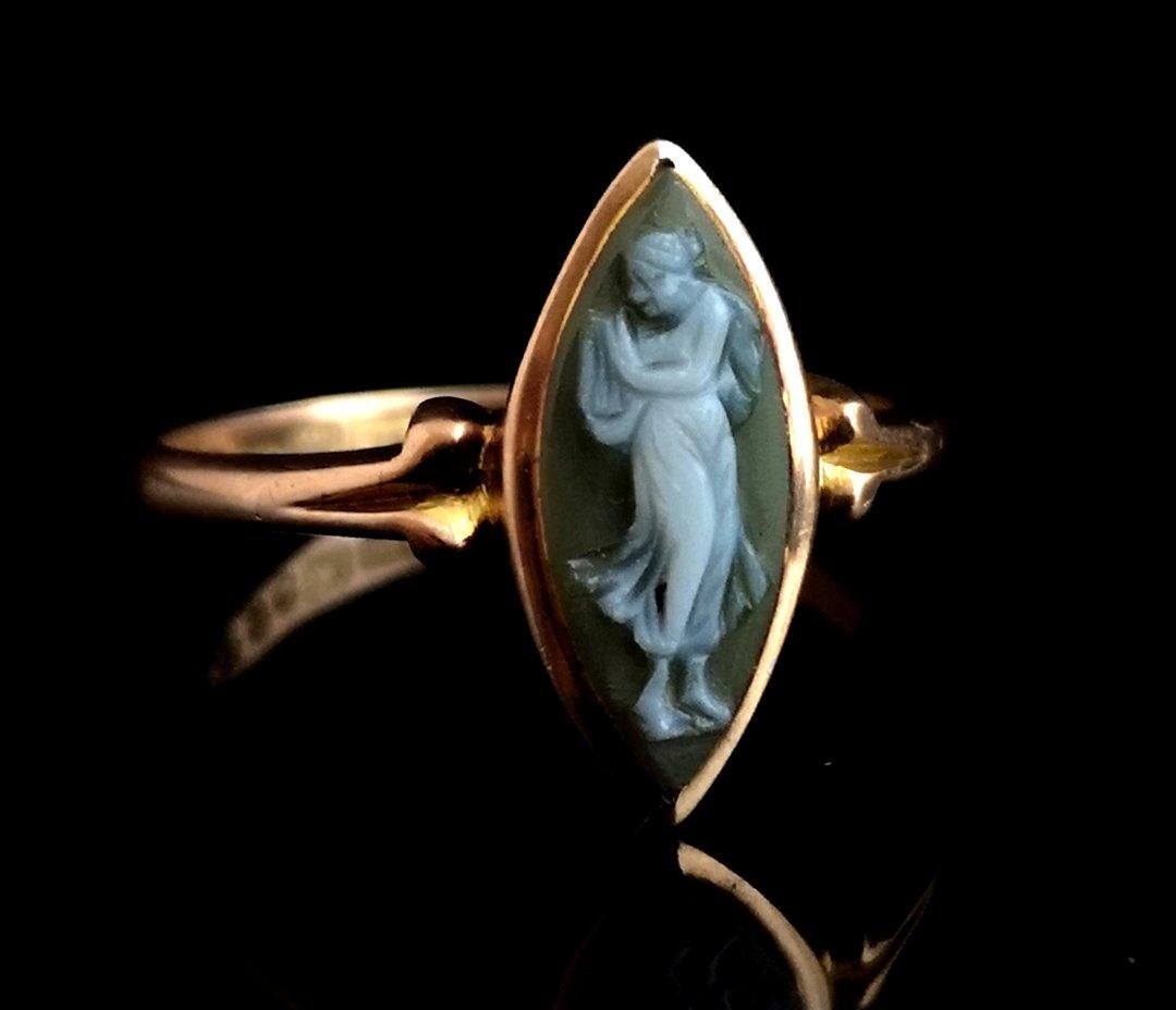 A beautiful antique 9 karat Rose gold cameo ring.

This special piece has lots going for it, the cameo is carved from a green agate, these were scarcer found than other cameos, it has a classical figure standing in white.

It has a highly sought