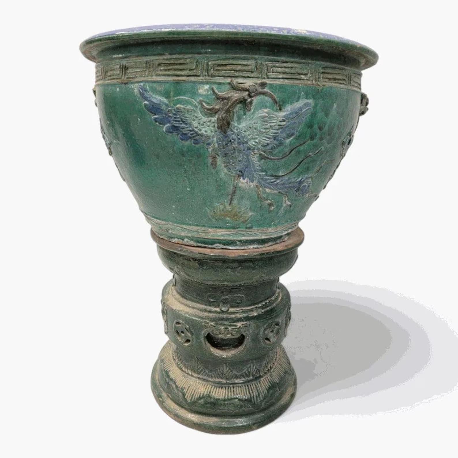 Antique Green and Blue-Glazed Planter Pot from Guangdong Province with Stand

This decorated planter originates from Guangdong, located on the north shore of the South China Sea. The bowl is adorned with mythical blue birds. Display this stoneware