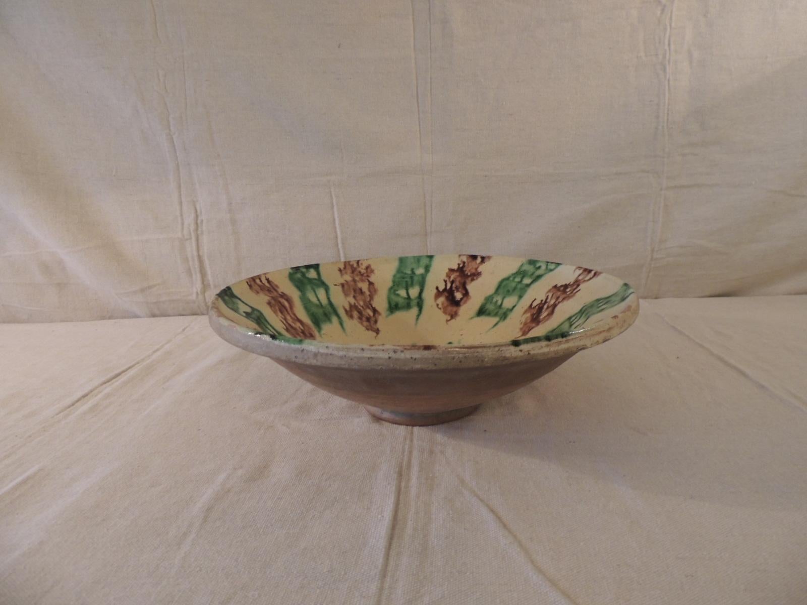 Antique green and brown glazed terracotta bowl
Size: 12.5