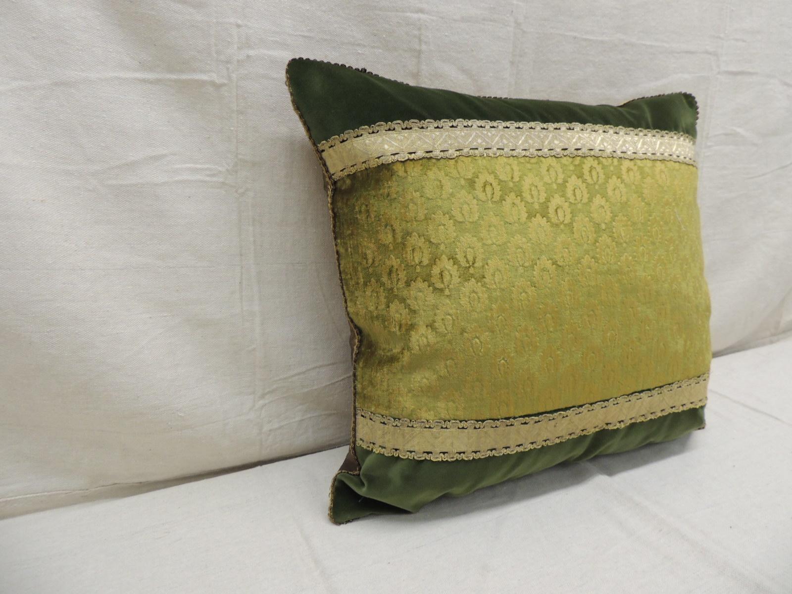 Antique green and gold Gaufrage silk velvet square decorative pillow.
Frame with green velvet and embellished with 19th century
silver woven metallic trim. Small decorative gimp all around and golden silk backing.
Decorative pillow handcrafted