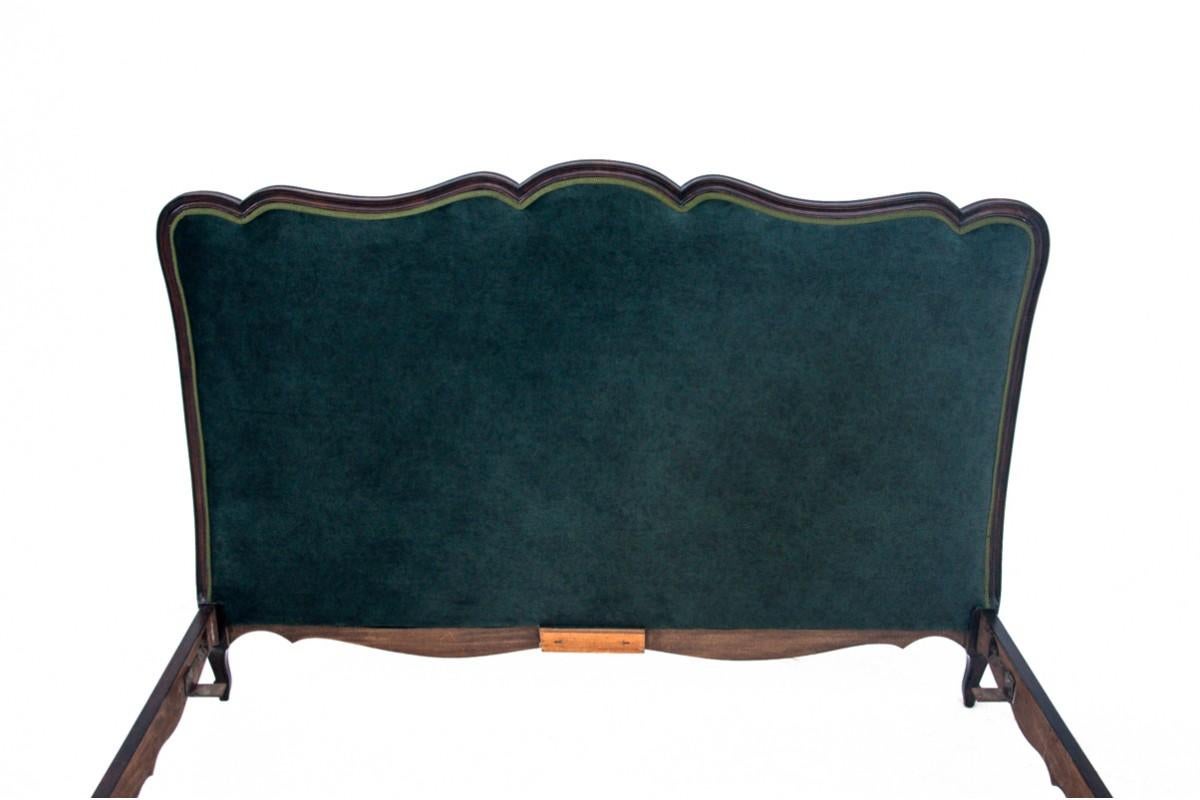 An antique bed from the beginning of the 20th century. The furniture is in very good condition, after professional renovation. Upholstered elements are covered with a new fabric.

Dimensions: height 109 cm / width 160 cm / length 213