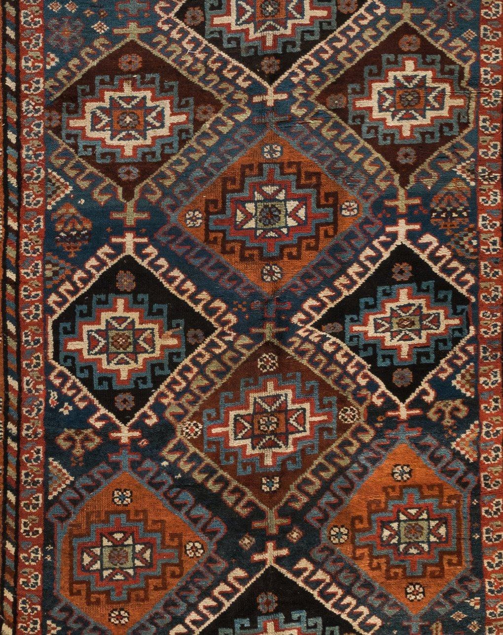 This lovely antique Persian Kurdish green carpet measures: 4.11 x 9.6 ft. and is from 1920s-1930s.