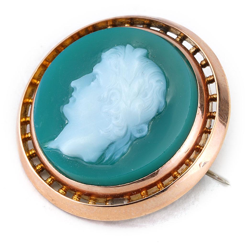 This antique green cameo pin is made of 14K yellow gold. Measurements are 3/4