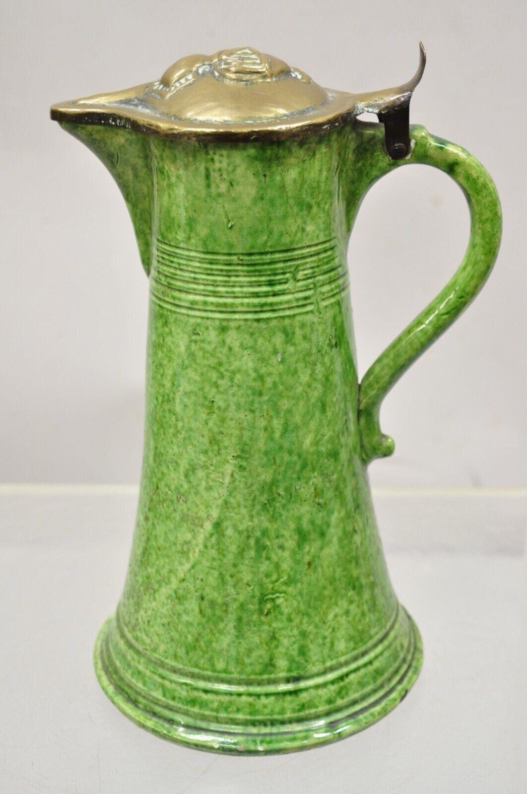 Antique Green Ceramic Gothic Renaissance Pitcher with Brass Soldier Armor Lid. Circa 19th Century. Measurements: 12