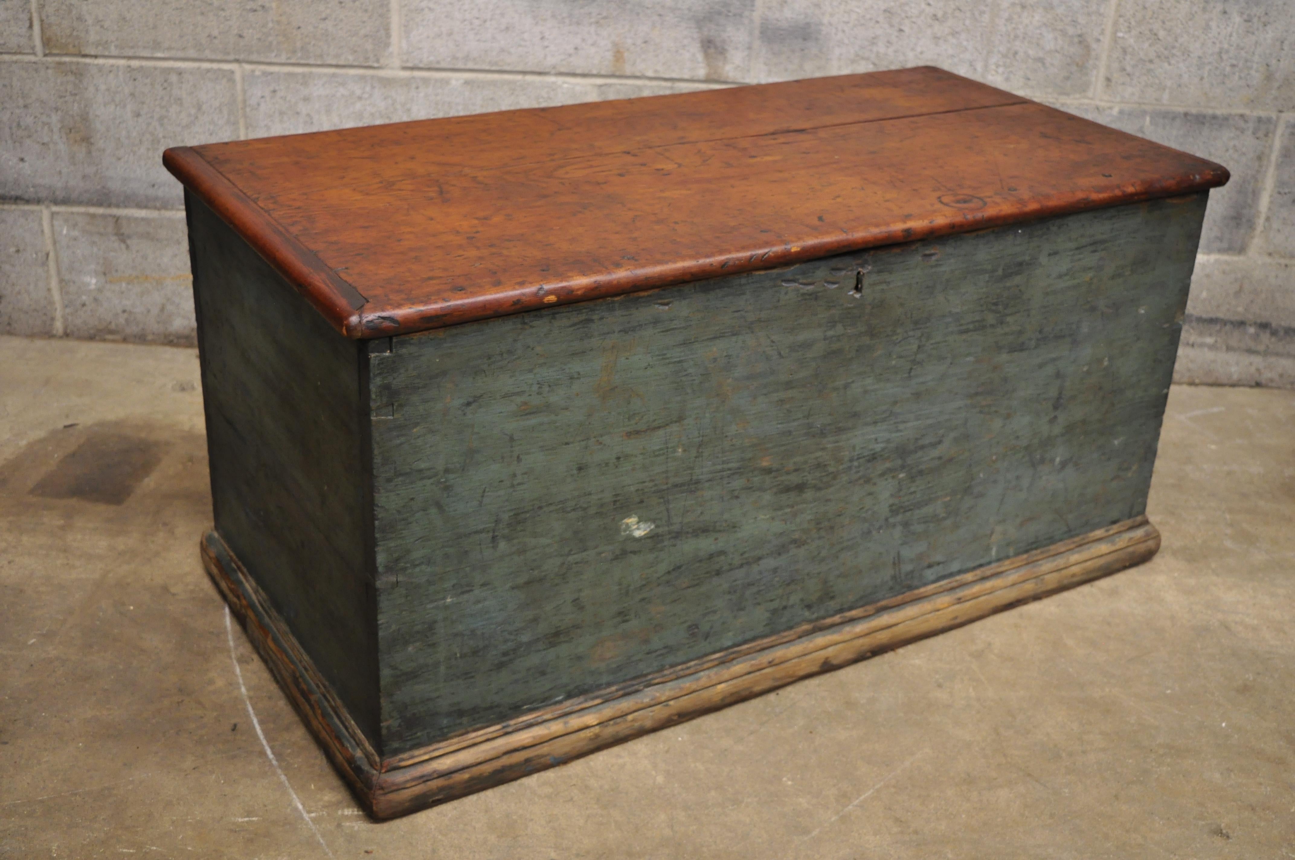 Antique 19th century green distressed painted blanket chest trunk with dovetail construction. Item features remarkable aged patina to blue finish, dovetailed construction, cast iron hardware, solid wood construction, very nice antique item, quality