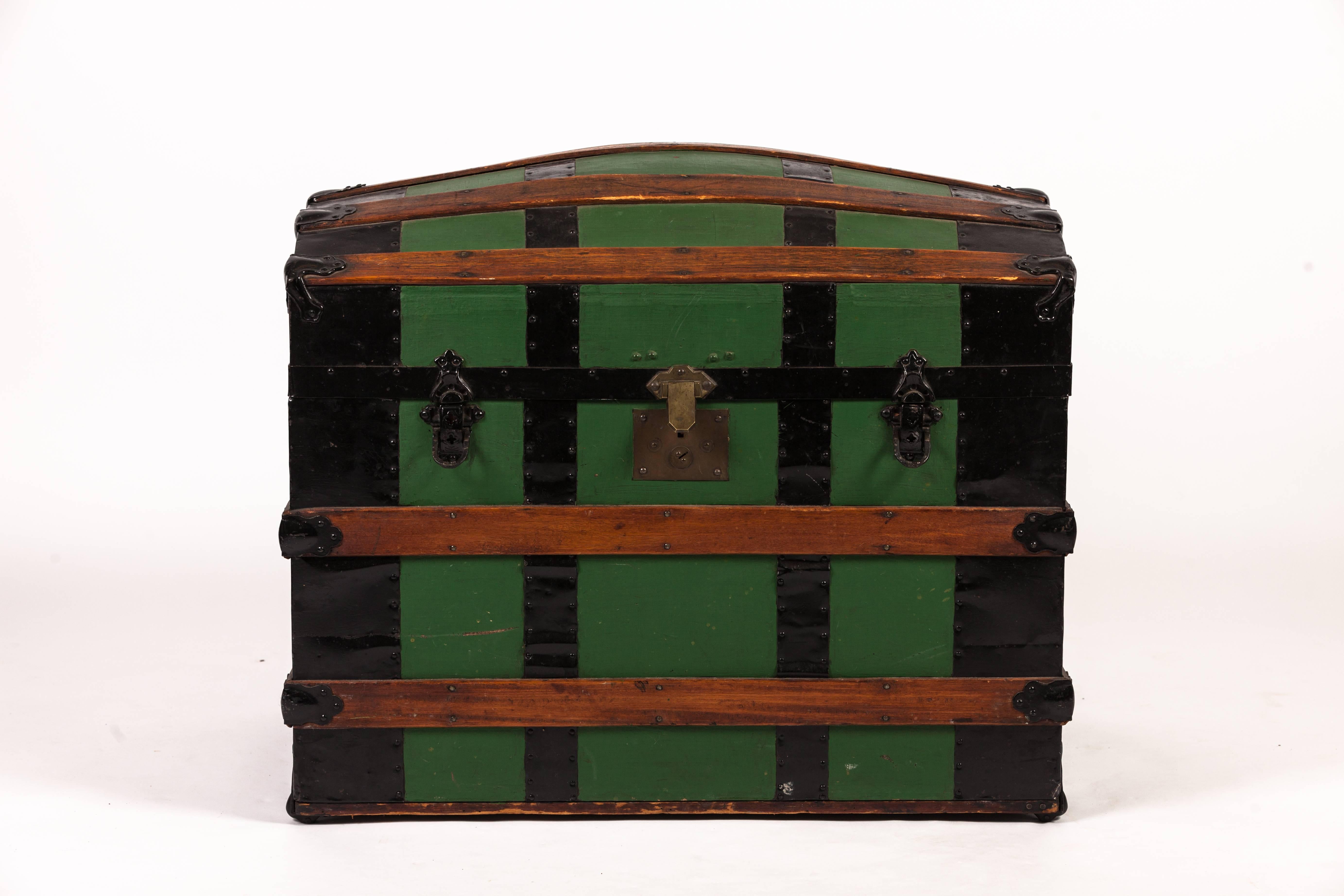 Antique green dome carriage trunk.
