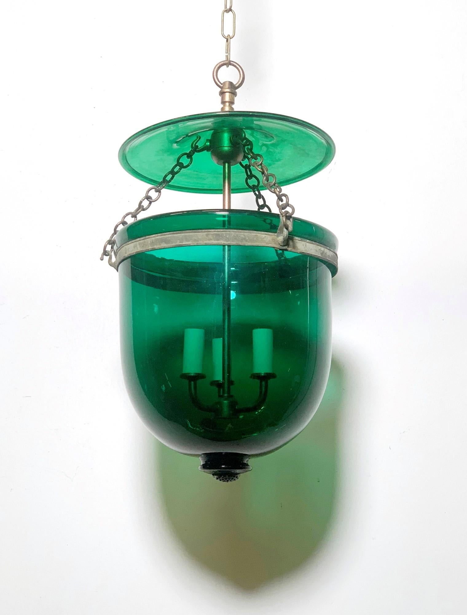 Antique original hand blown green glass bell jar and lid pendant light from Europe. Features new brass hardware and wiring. This can be seen at our 400 Gilligan St location in Scranton, PA.