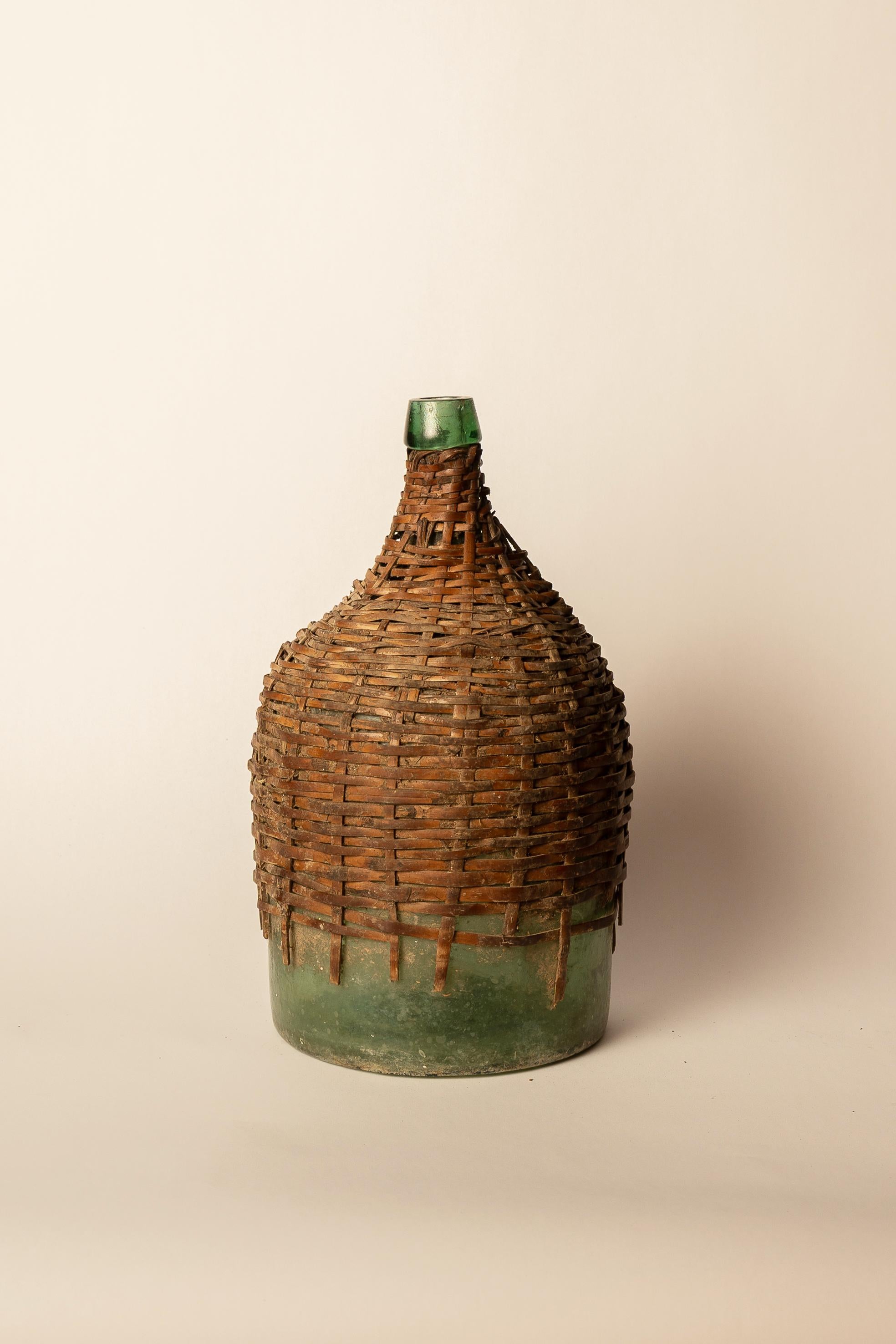 Folk Art Antique Green Glass Carboy with Wicker Cover For Sale