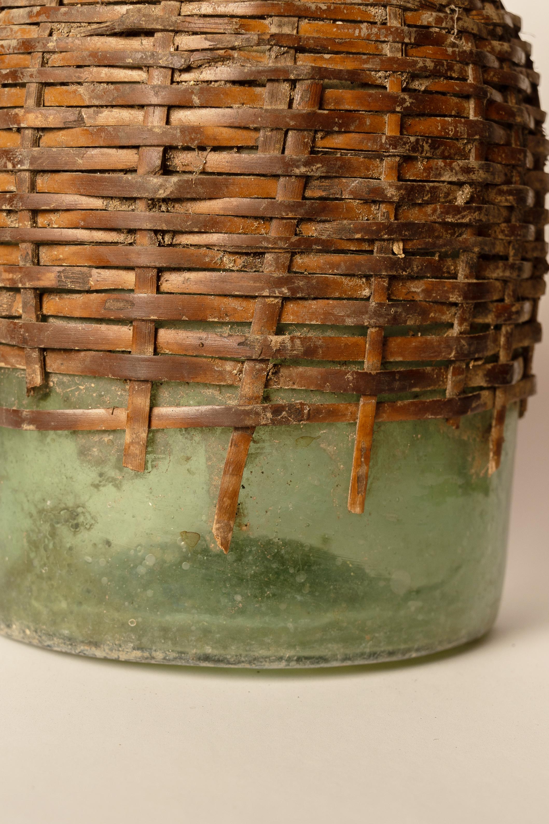 19th Century Antique Green Glass Carboy with Wicker Cover For Sale