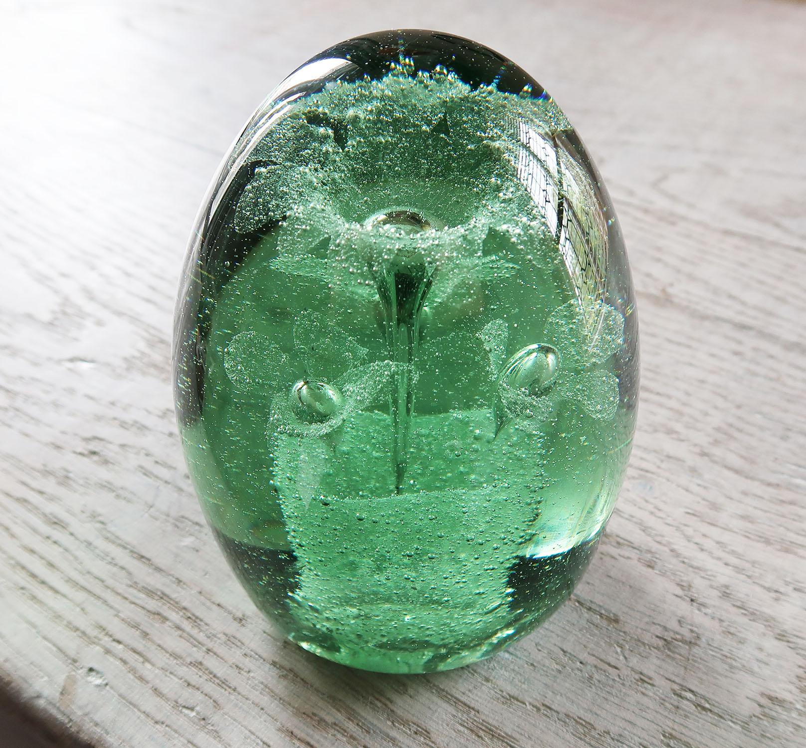 Wonderful piece of green glass with a frosted floral interior.

Most likely originally a doorstop or a paper weight

Good condition. There is a tiny bruise shown in one of the images.


   