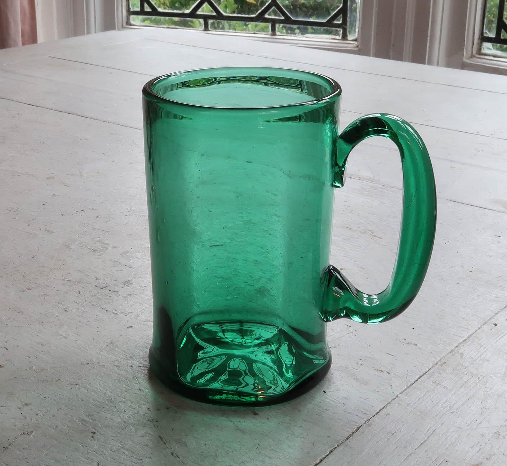 Very smart green glass tankard

Wonderful colour of green

Great to use as a tankard but can also be used as a flower vase

Good condition.

Free UK shipping
