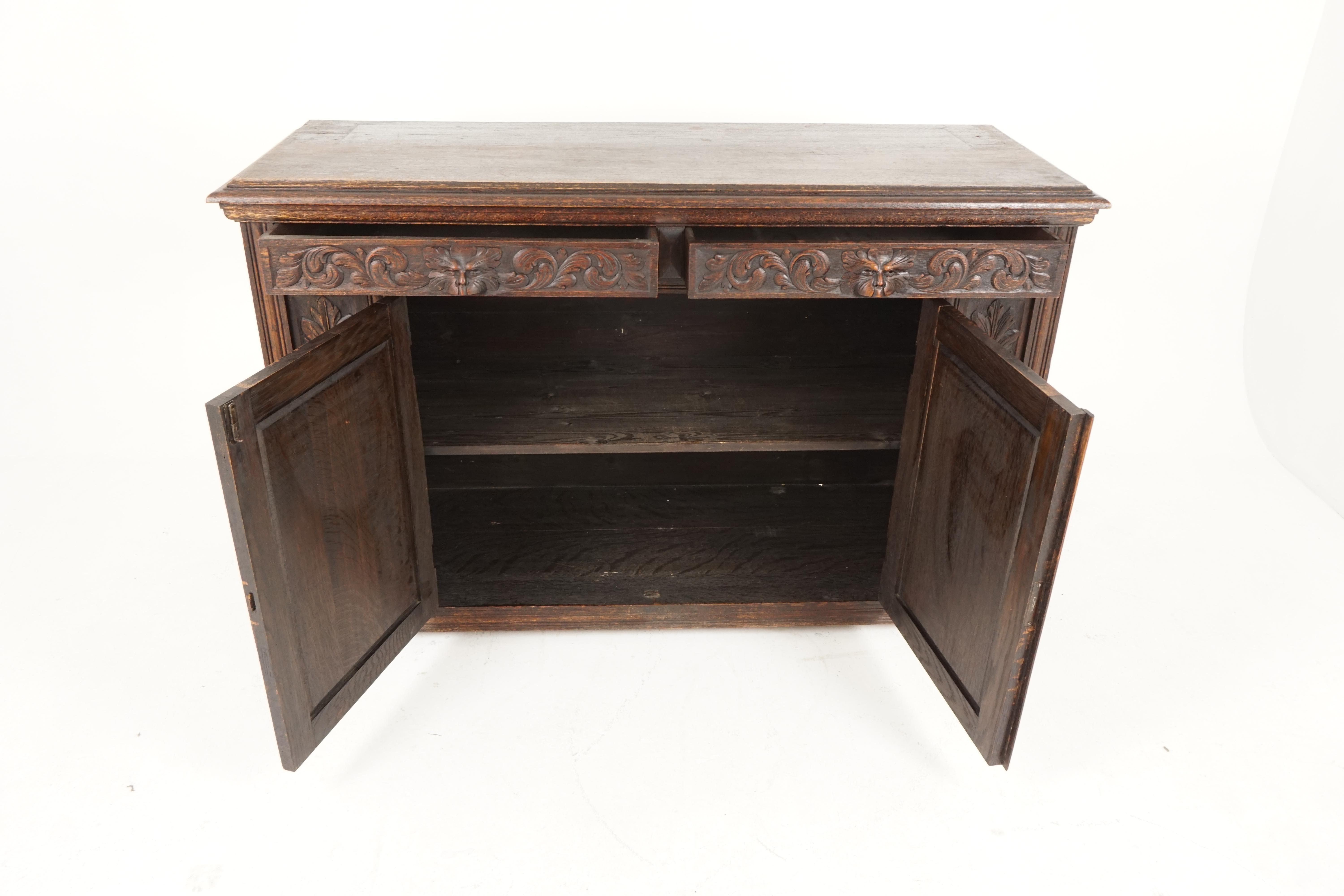 Antique green man Gothic carved oak sideboard, buffet, Scotland 1880, B2254

Scotland, 1880
Solid oak
Original finish
Rectangular top with moulded edge
Pair of carved green man drawers
Underneath is a pair of caved paneled doors
Opens to