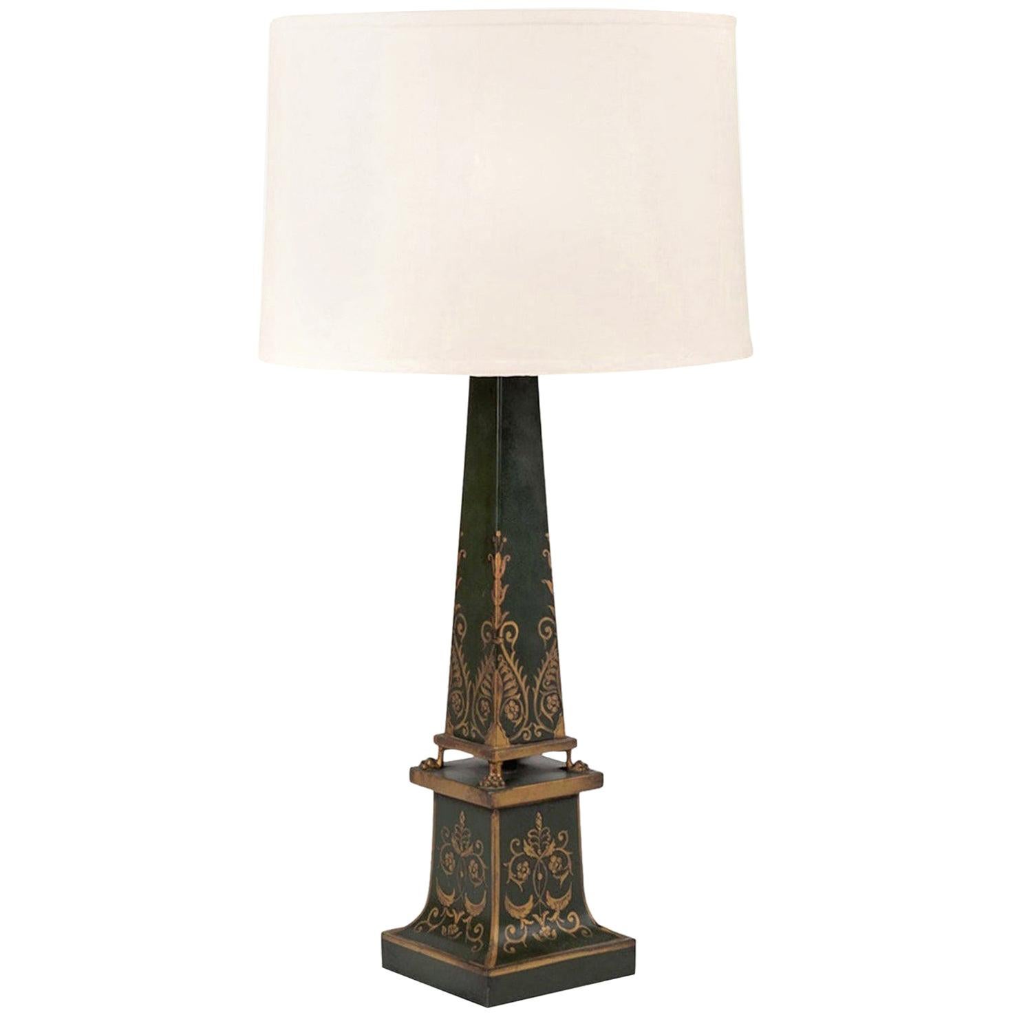 Antique green-painted tole table lamp with gold decoration, newly wired for use within the USA using all UL listed parts. Includes complimentary linen shade (measurements include shade).