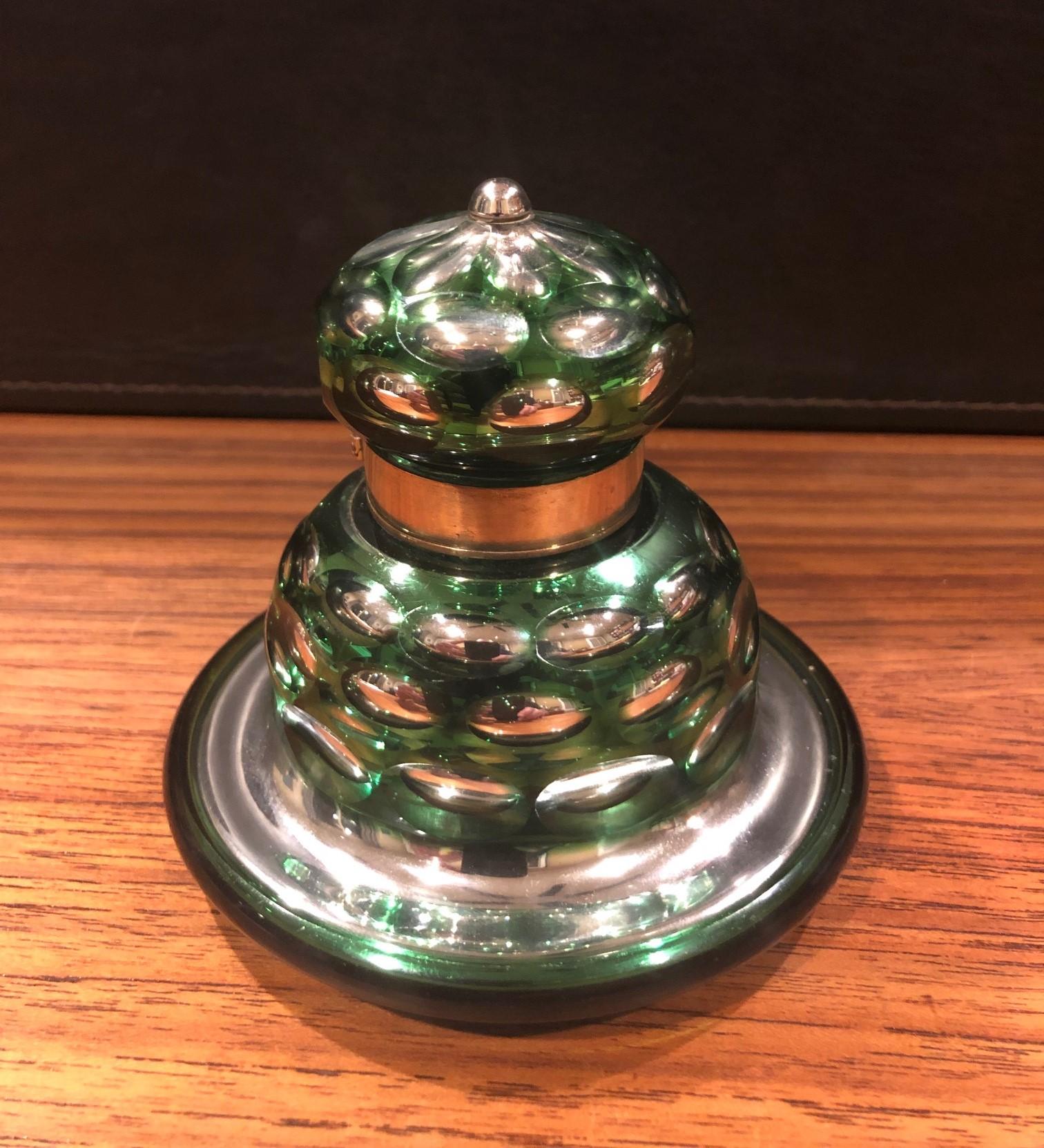 A large antique green and silver mercury glass Inkwell by W. Lund of London, circa 1890s. 

The well is bell shaped with a brass hinged lid. There is a metal medallion under glass on the base marked 