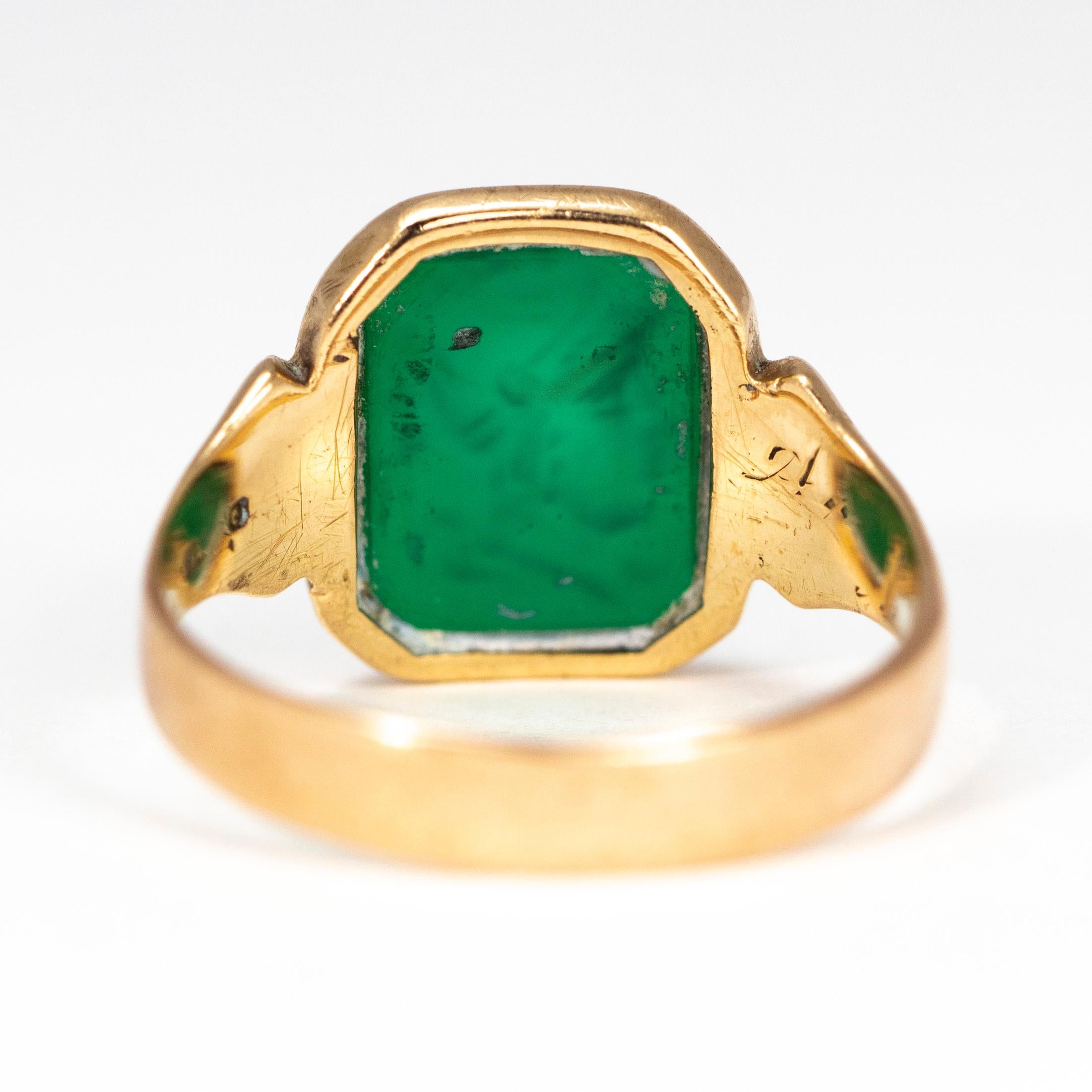 gold signet ring with green stone