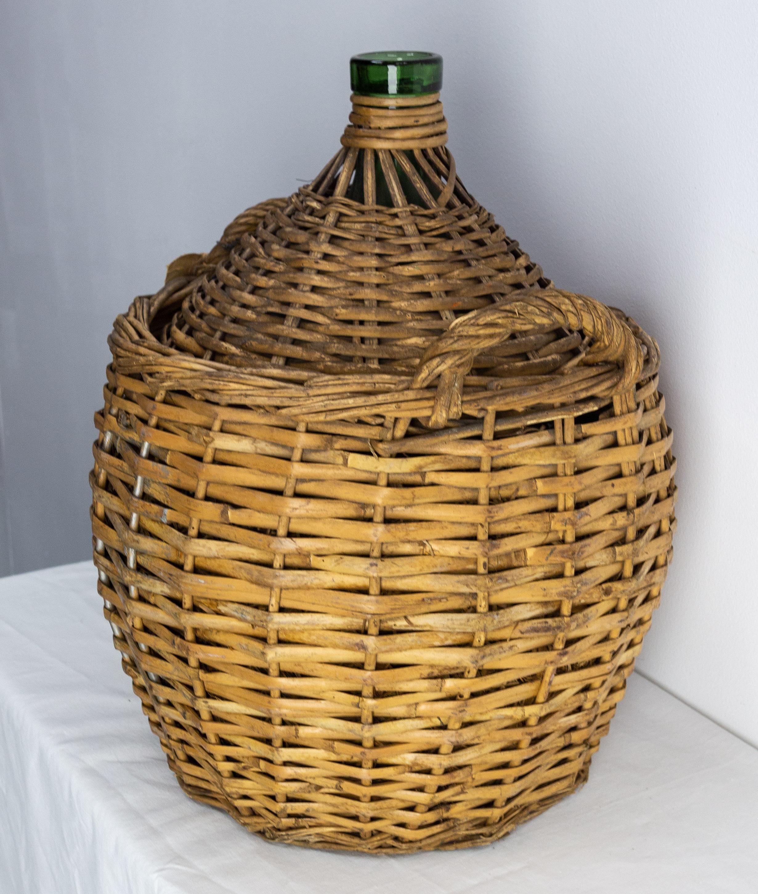 French Provincial Antique Greenglass Bottle Demijohns or Carboy in Authentic Wicker Basket, France For Sale