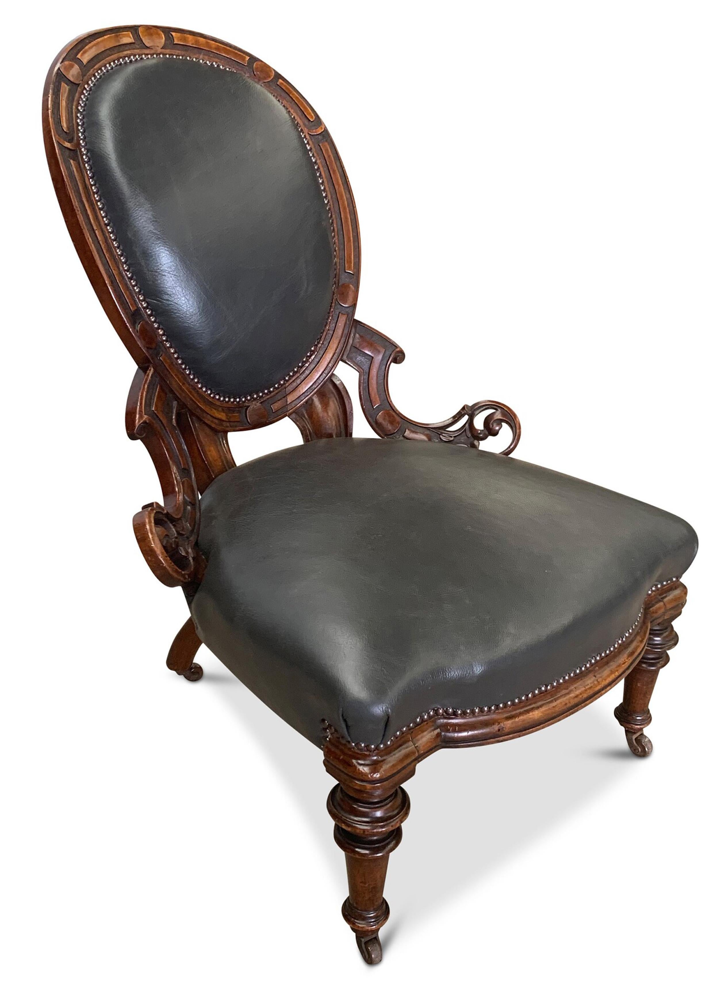 British Antique Grey Leather & Walnut Library Chair With Carved Motifs with Brass Studs For Sale