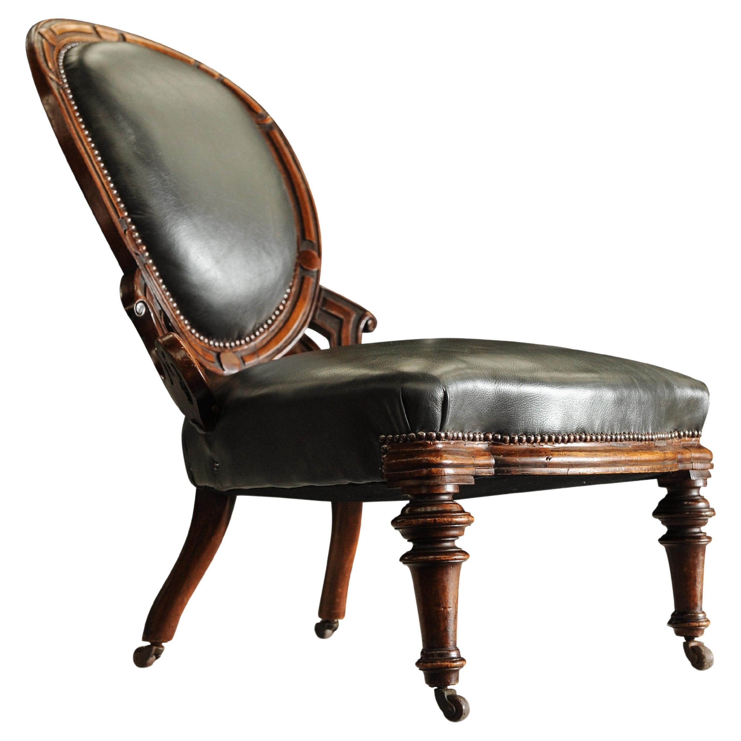 Antique English Regency Leather & Walnut Library Chair With Carved Motifs