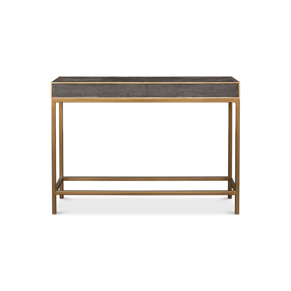 Antique Grey Leather Wrapped Console Table, the perfect addition to your chic and sophisticated living space. The luxurious leather wrap exudes a warm, inviting feel, while the gleaming gilded trim frames the eye-catching embossed faux shagreen