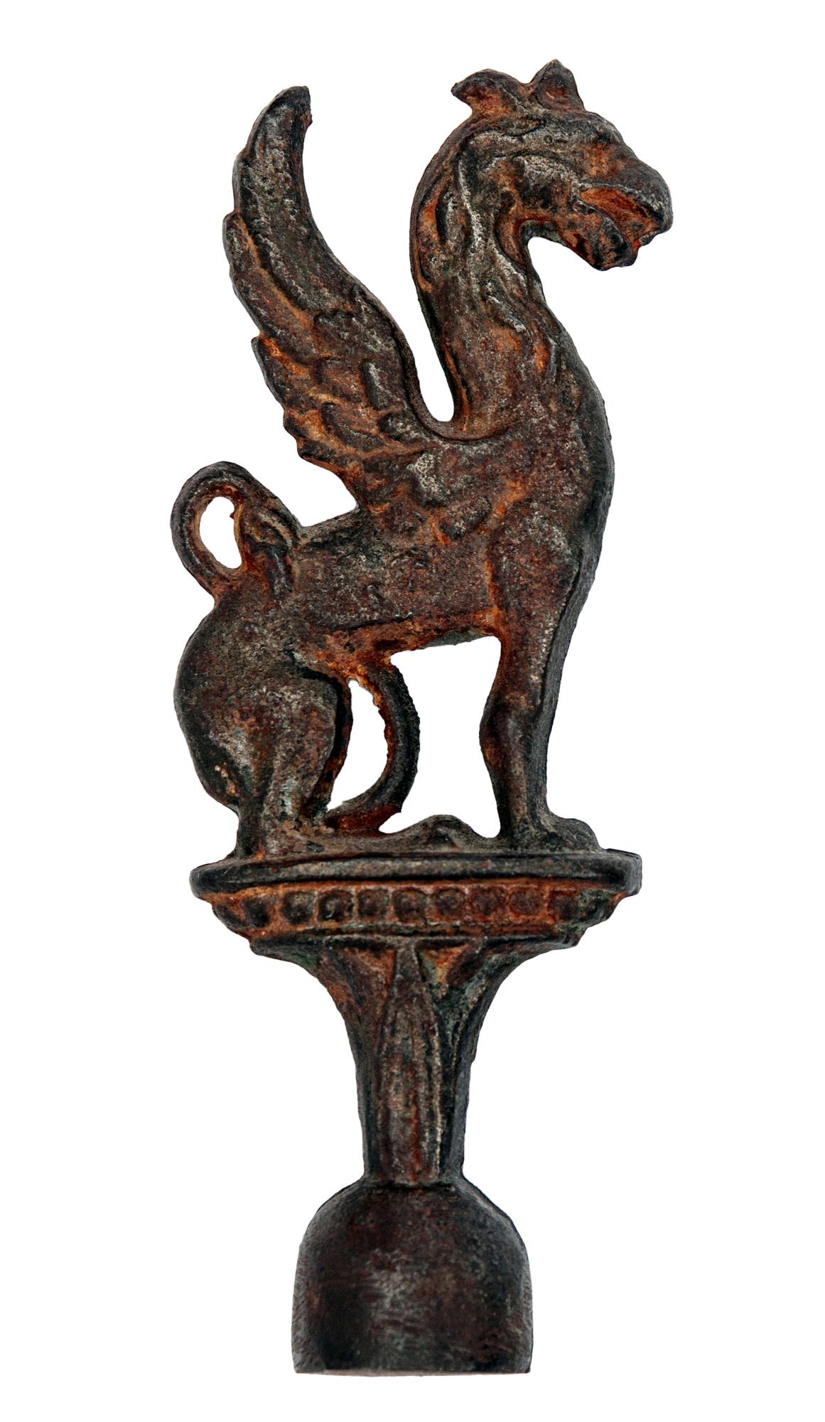 Rare Antique Griffin Finial, Decorative Arts.
Ornate detailing appears to be brass or bronze.
Measures approximately 4 3/4