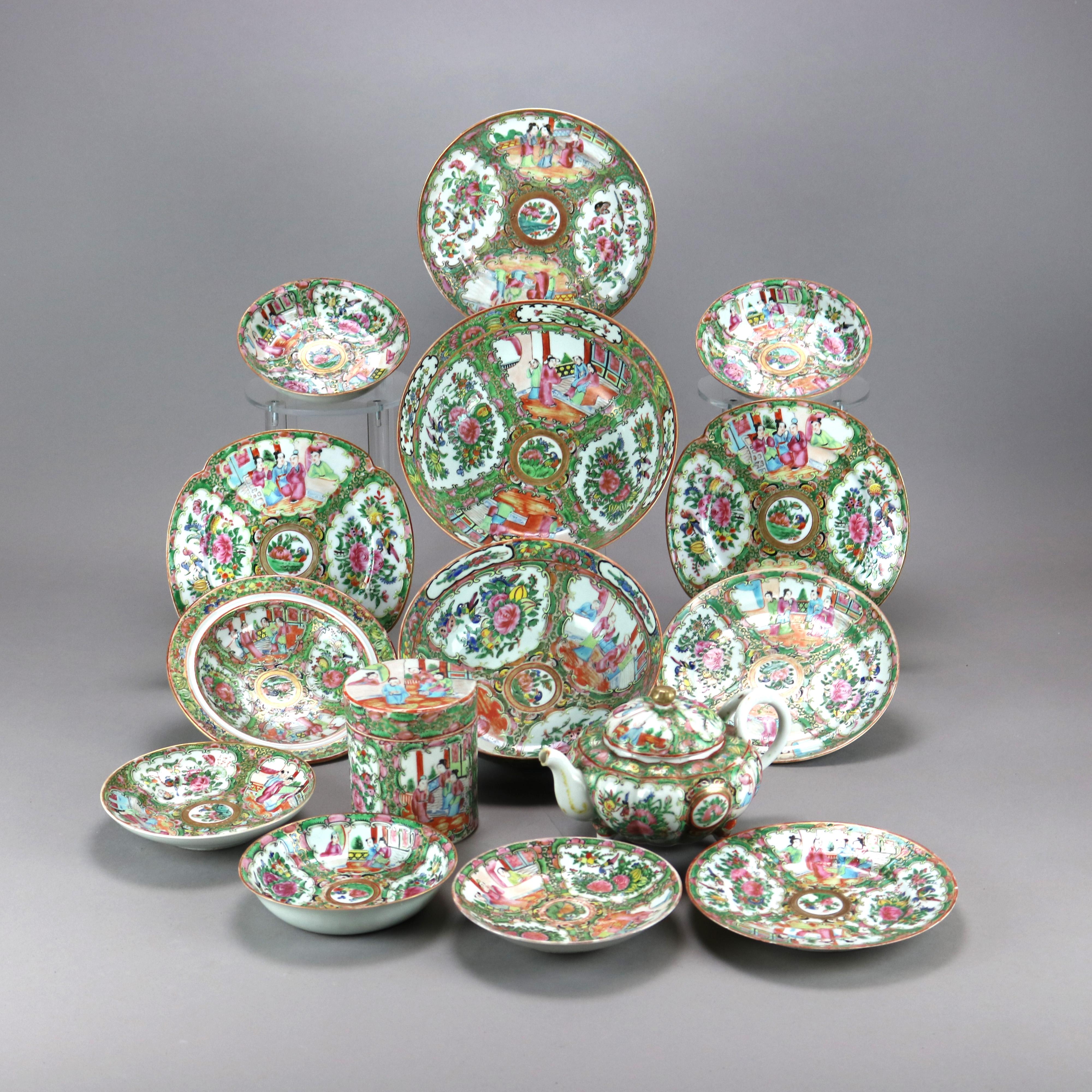An antique grouping of fifteen Chinese Rose Medallion porcelain dining items offer reserves of genre and garden scenes and include plates, bowls, tea caddy and teapot as outlined below, circa 1900

Measure - 3 soup bowls 6''H x 6''W x 1.5''D; 2