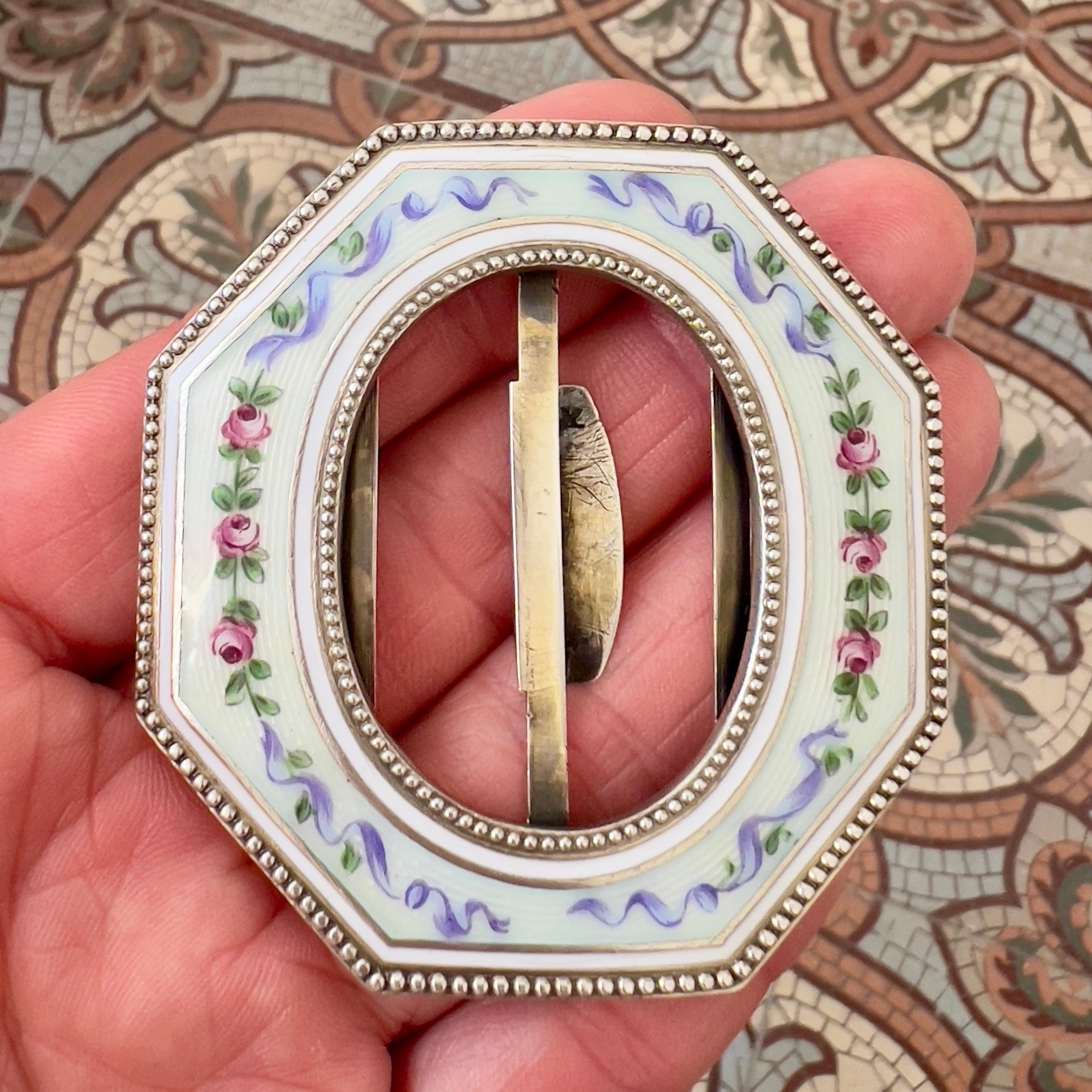 This beautiful antique buckle is a fine example of Edwardian or early 20th-century European craftsmanship. Rendered in sterling silver (.925, fully hallmarked), the piece features a stunning octagonal form measuring approximately 6 cm wide by 6.5 cm