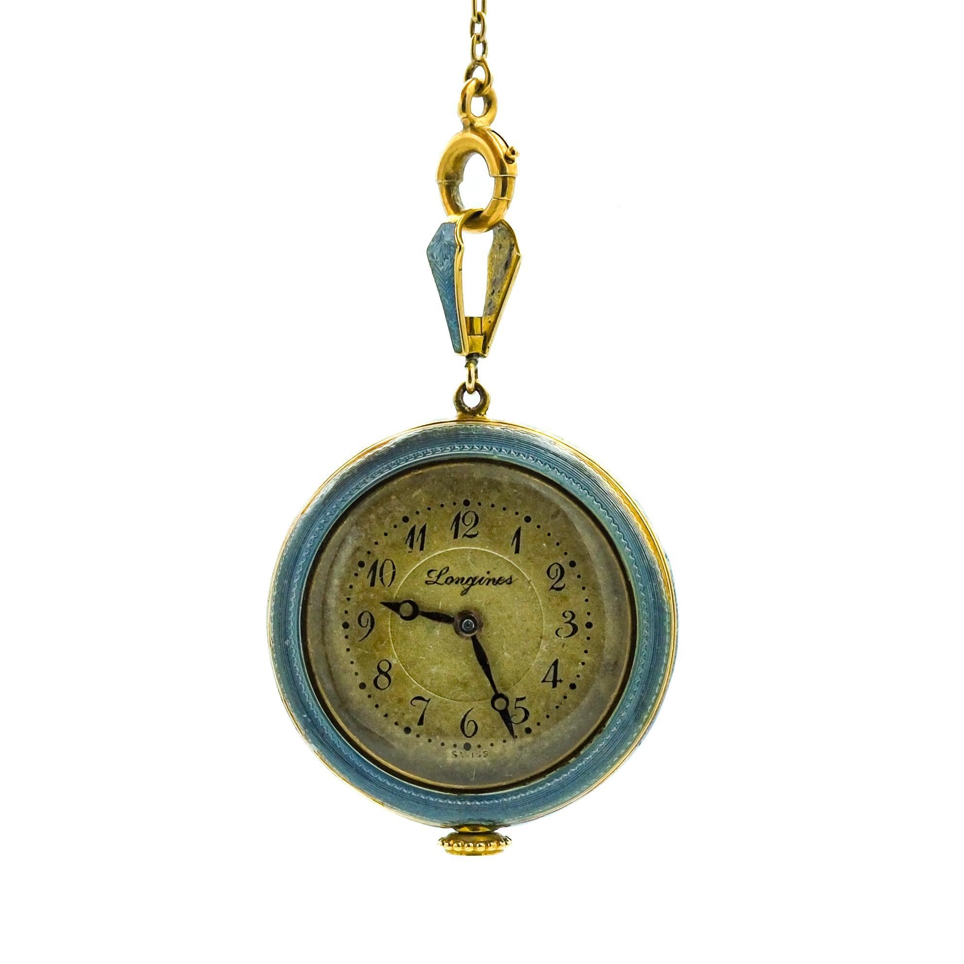 Presenting an exquisite Antique 14 Karat Guilloche Enamel Longines Pocket Watch Lavalier Necklace. The lavalier necklace features a finely detailed guilloche enamel design, with the centerpiece being an antique Longines pocket watch, known for its