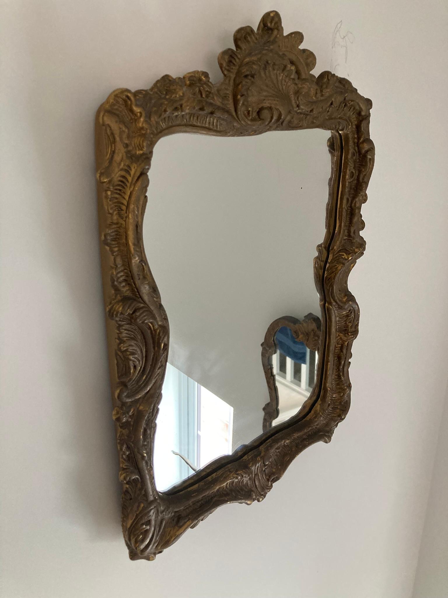 Antique Guilt wood and Gesso Rococo style wall mirror, slight foxing to the glass giving it real character and charm. 

H: 56 cm

W: 38 cm

D: 5 cm