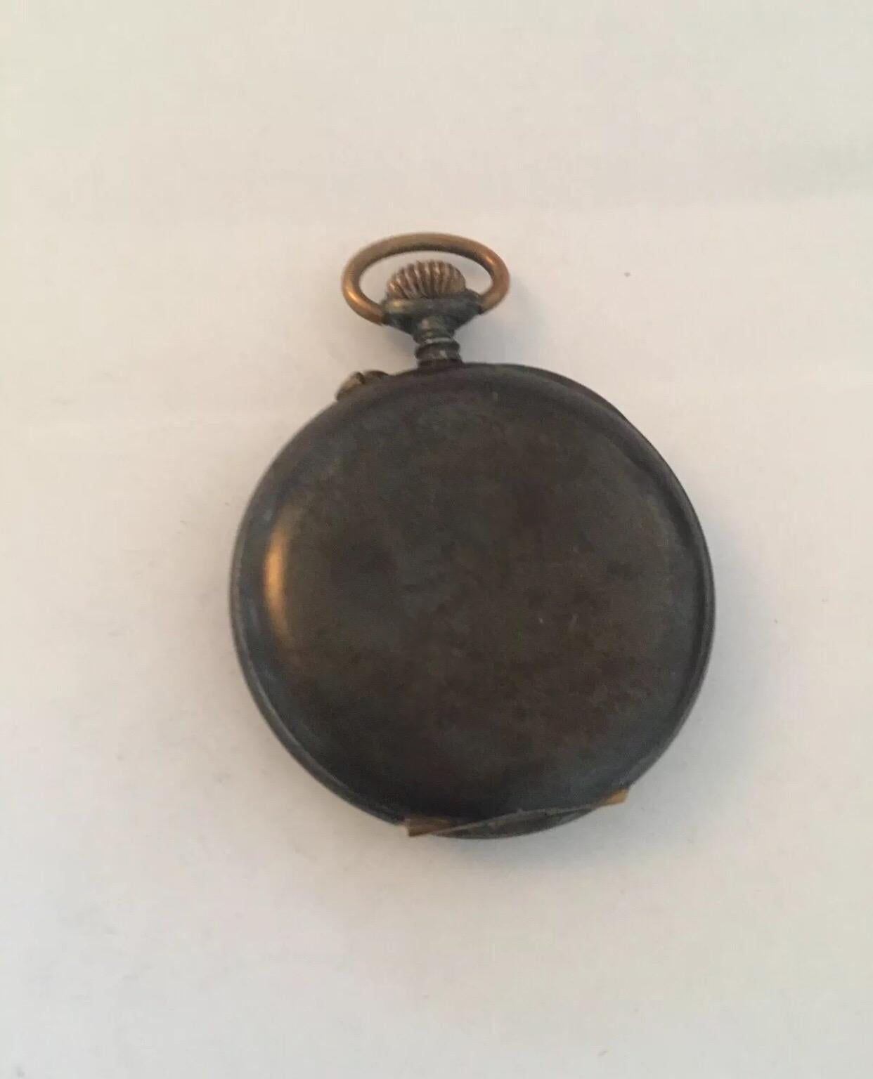 Antique Gunmetal Pocket watch. This watch is working and ticking well, but The hands needs adjustments. Minute hand touches the hour hand