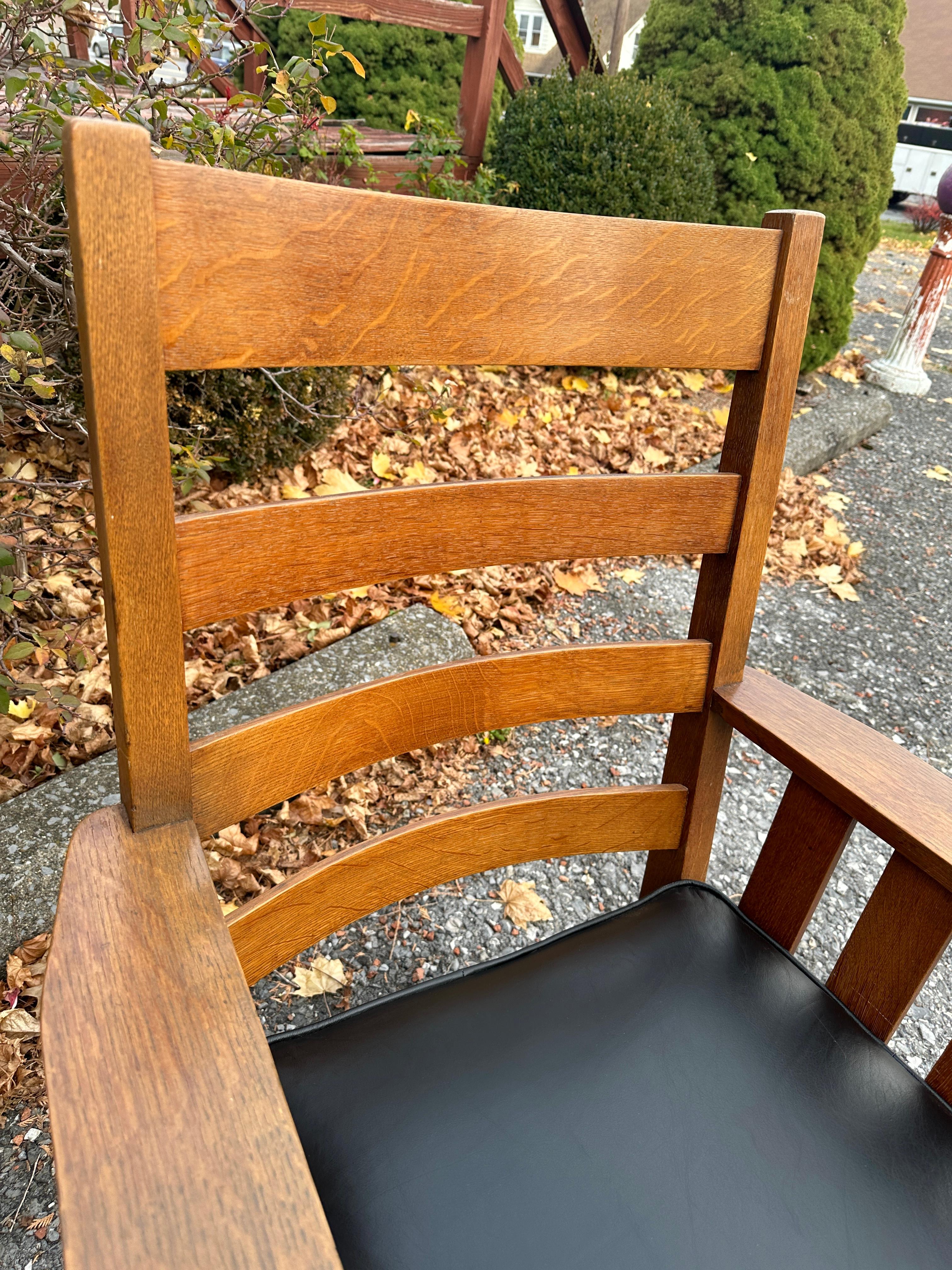 This is a nice, large Charles Stickley mission chair in good condition.  It is marked with the maker's mark on the back stretcher.  Reupholstered with top quality hand-spun leather. The seat has the original spring set, which was adjusted for