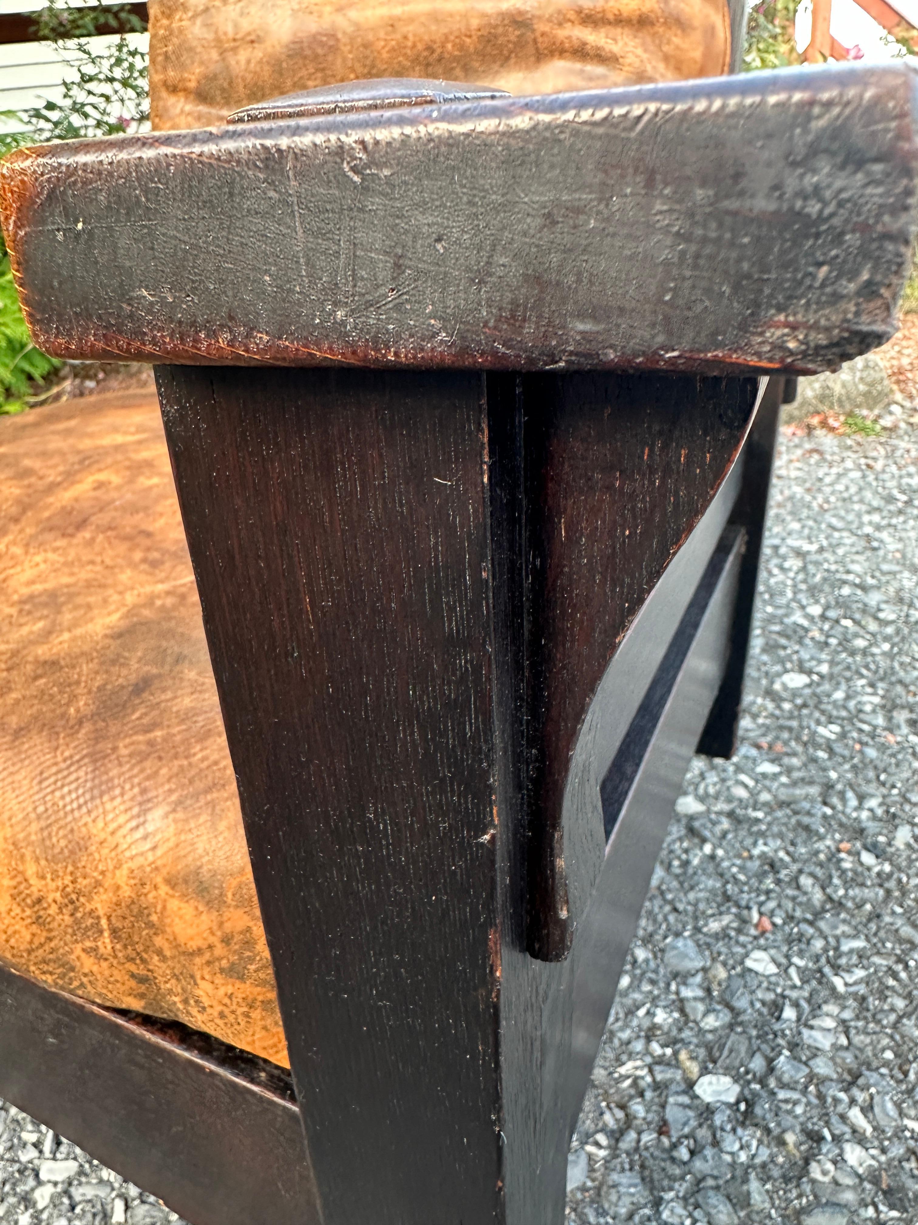 This is a very important Gustav Stickley Bow Arm Morris Chair from 1901.  It comes with the original leather seats and back. You just don't find a 120+ year old chair with good original leather seat and back!  The oak wood on this chair has no