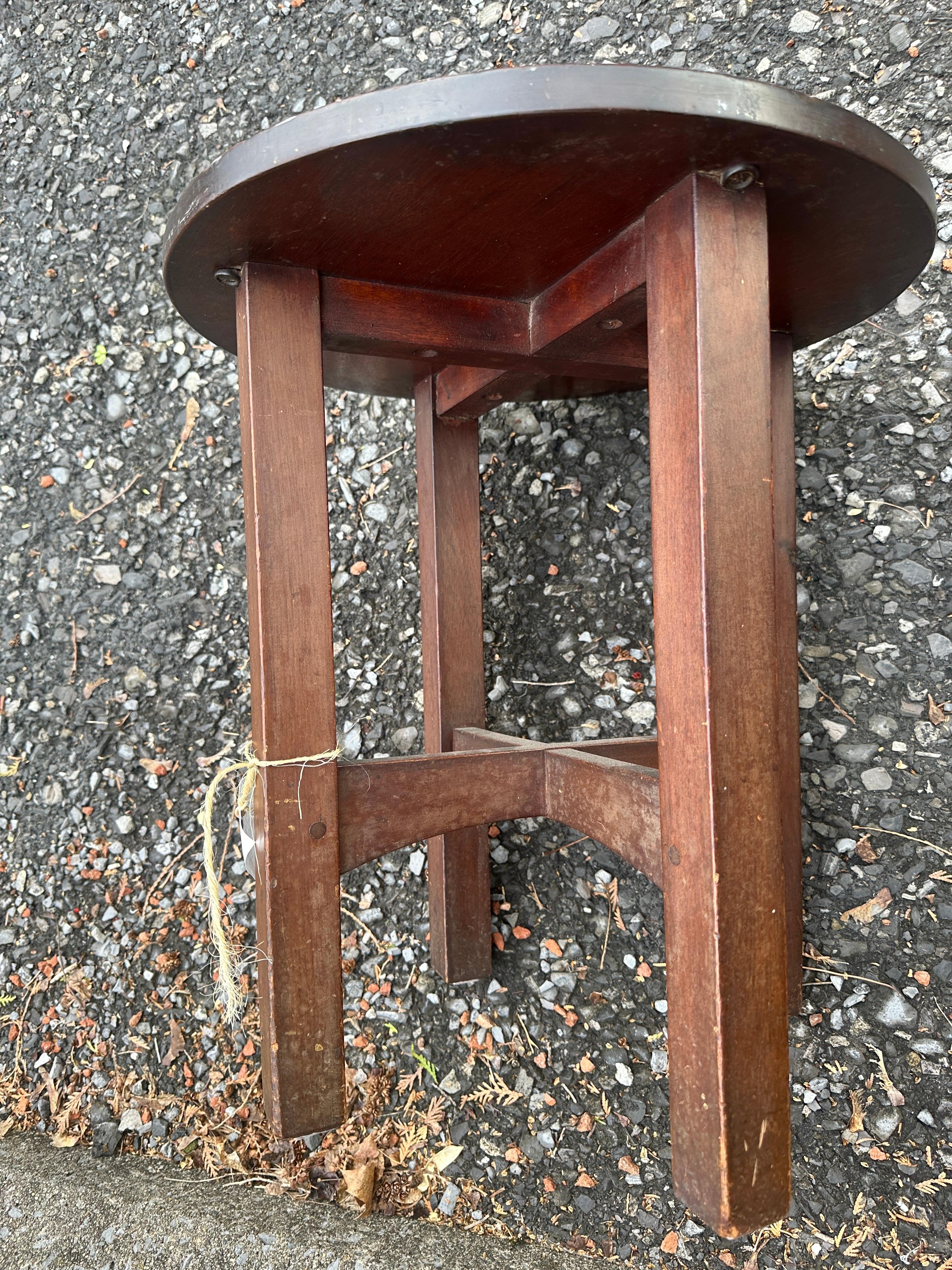 This is an antique Gustav Stickley Small Table, or Tabouret, from the early 1900s.  It is in excellent condition and is marked with a Stickley decal.  This is a very nice piece and is ready for use in your home or office.

Gustav Stickley was a