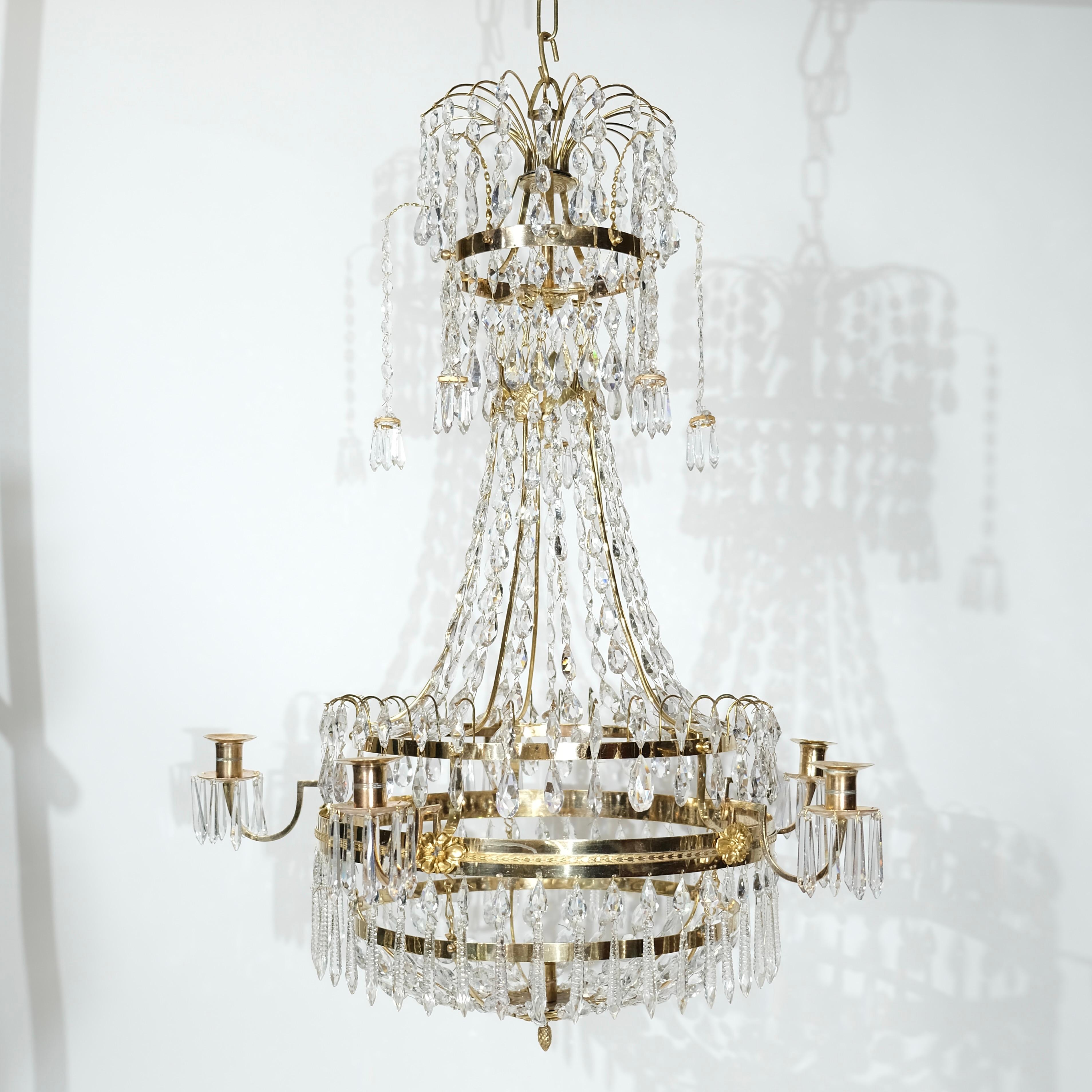 A rare Swedish Gustavian chandelier made around 1810 by Swedens foremost chandelier maker during the Gustavian era, Carl Henric Brolin. He is one of only two chandelier makers that signed their works.
This chandelier is made of gilt brass and bronze