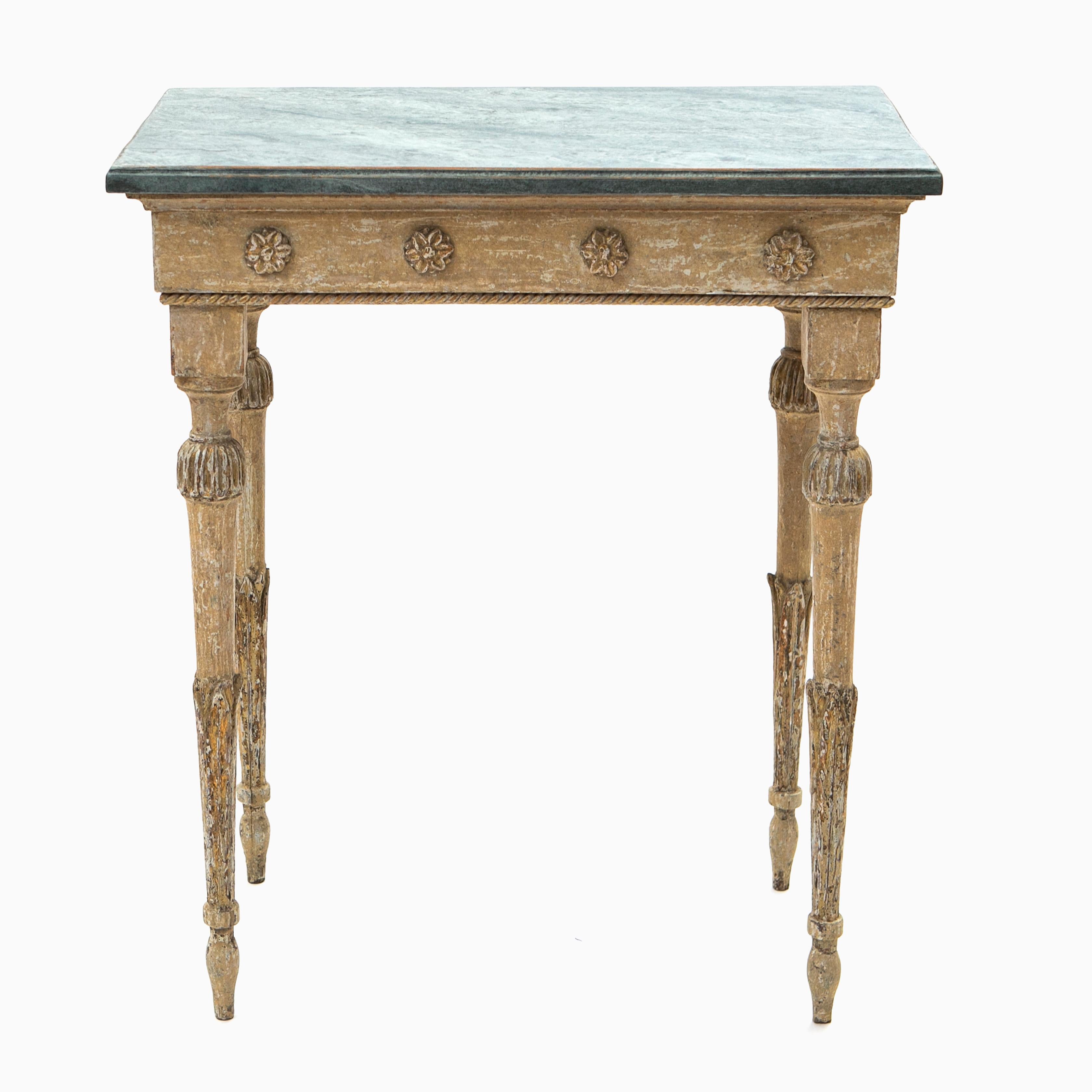 Antique Swedish console table from the gustavian period.
The table has been dry scraped by hand down to traces of the original ocher yellow paint which has a rustic surface and charming patina.
Wooden blue-green faux marbled tabletop.
Front apron