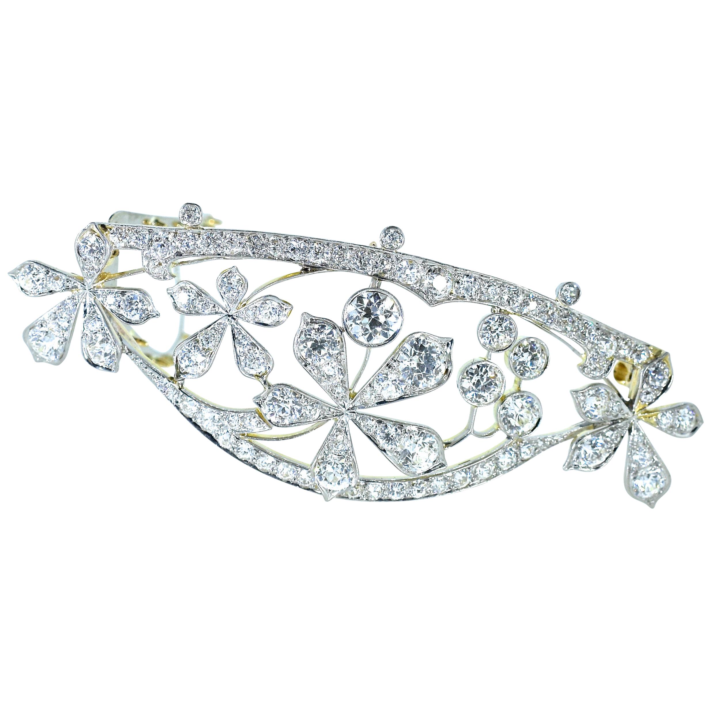 Antique barrette in platinum and backed in 18K yellow gold, with 100 fine white old cut diamonds amounting to approximately 6.95 cts.  The diamonds are all well cut and well matched, near colorless (H) and very slightly included, (VS).  This well