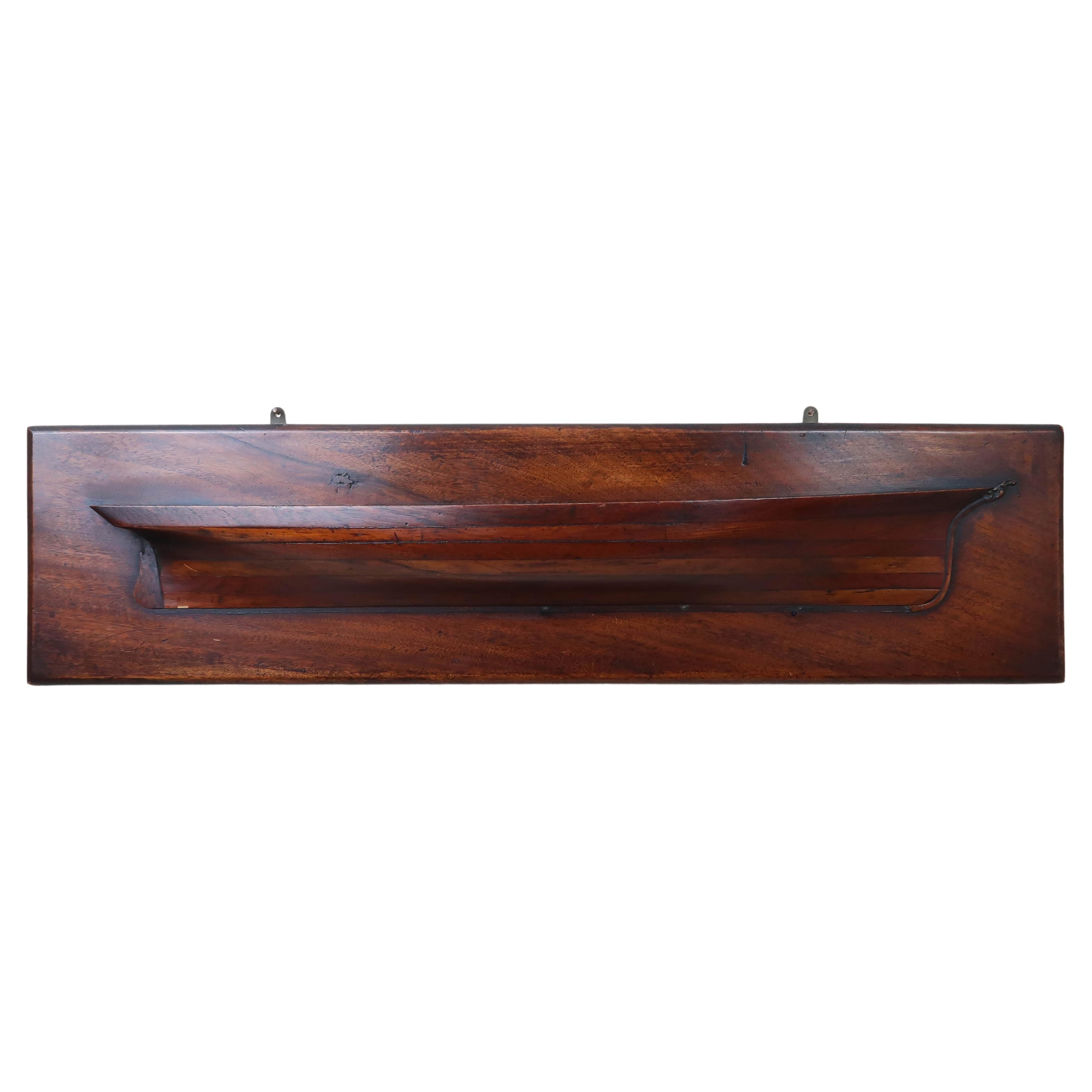 Wonderful half hull model.

Laminated tropical hardwood and pitch pine

Original patina and a fantastic colour

Exceptional quality.  I particularly like the finely carved mast.

There is a tiny sliver of veneer missing at the very bottom of the