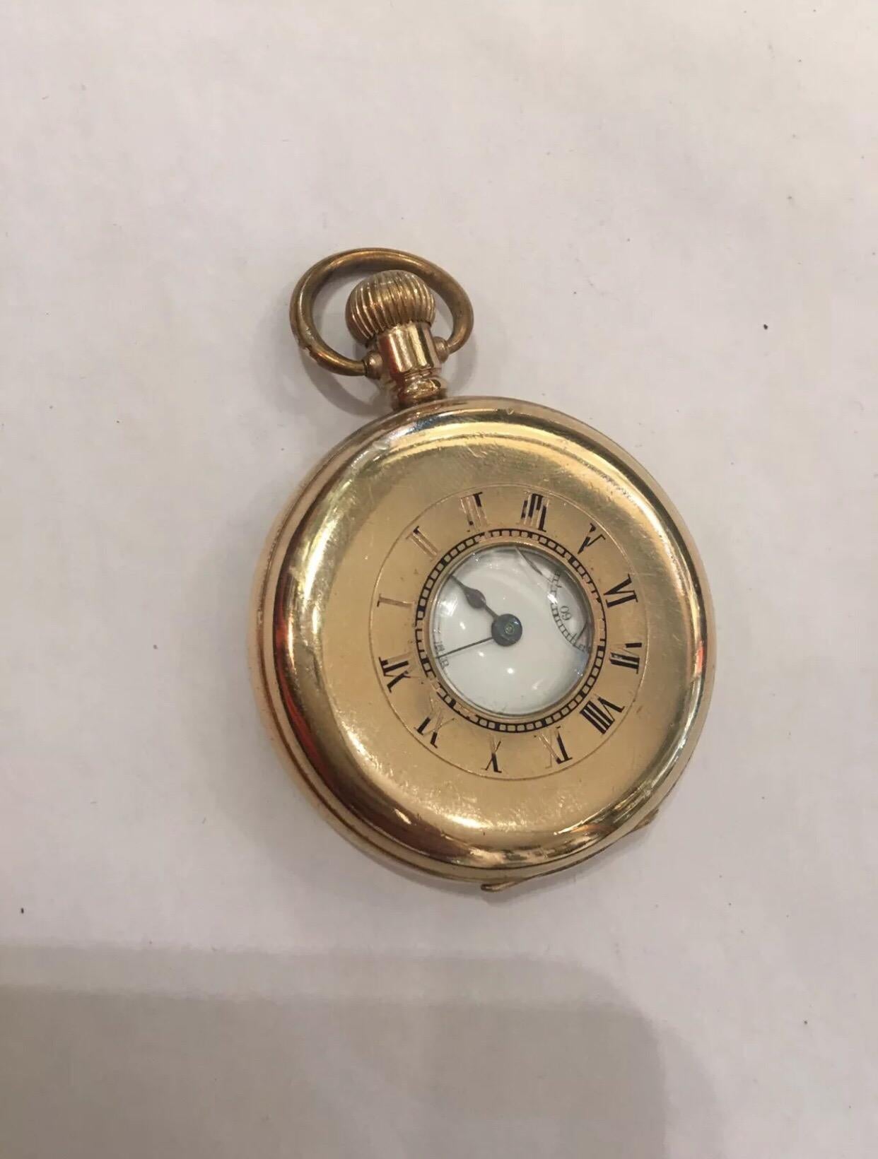 
Antique gold plated Half Hunter Dennison Cased Pocket Watch Signed Waltham U.S.A.

This watch is in good working order. And it is ticking well. There is a visible crack on the top cover glass.