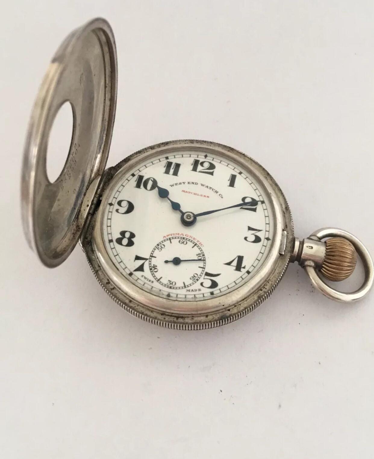Antique Half Hunter Engine Turned Case Silver Pocket Watch By West End Watch Co. 

This beautiful watch is working and ticking well. Top cover glass is missing.