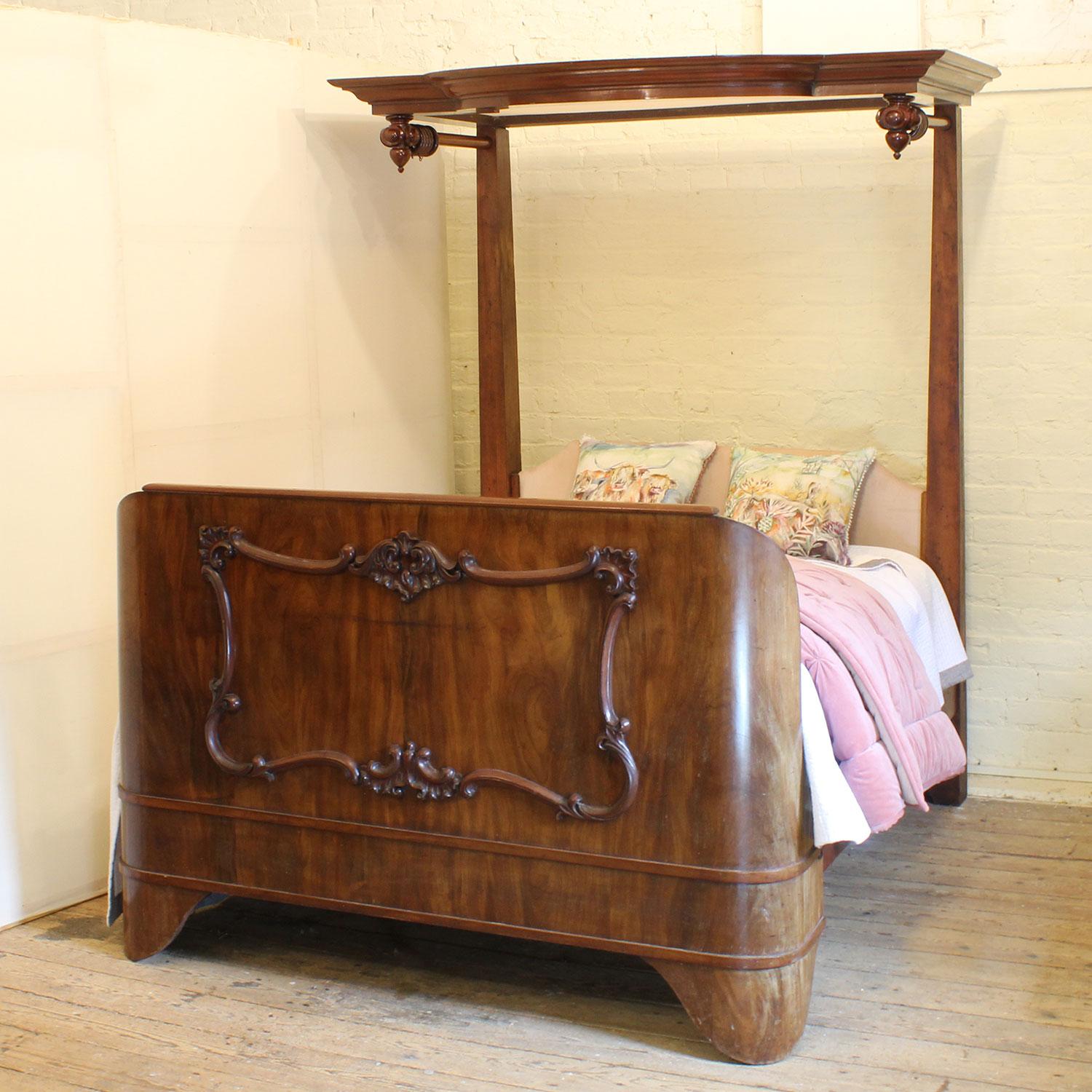 A magnificent mahogany Victorian half tester bed with flame veneer in the shaped foot panel, and serpentine shaped canopy with curtain rails and rings.
The upholstered back panel can be replaced and raised, and covered with a fabric of your chice.