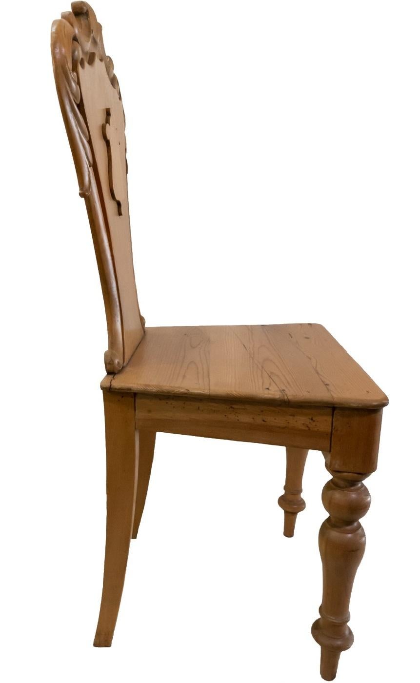 Pine chair with carved medallion back.