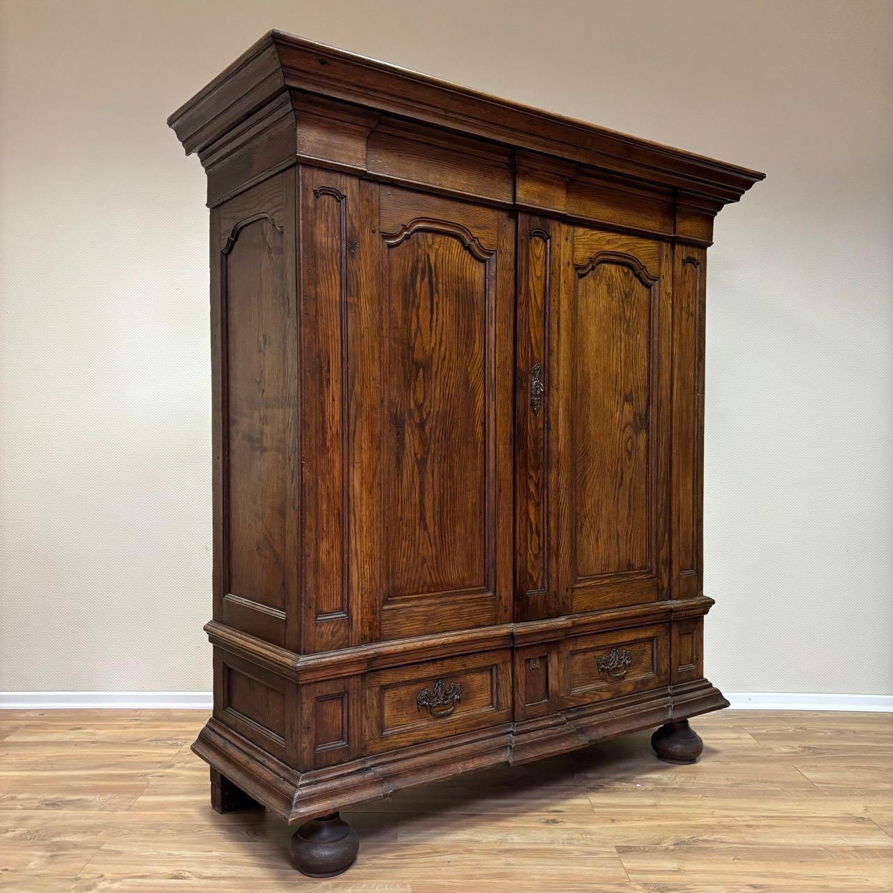 ✓ Impressive presence
✓ High quality materials
✓ Original locks & fittings

Dimensions: W: 172  H: 190cm  D: 66cm

Item: antique baroque cabinet
Item no.: 302
Epoch: Baroque around 1700
Material: Solid oak I
Color: Brown
Condition: very