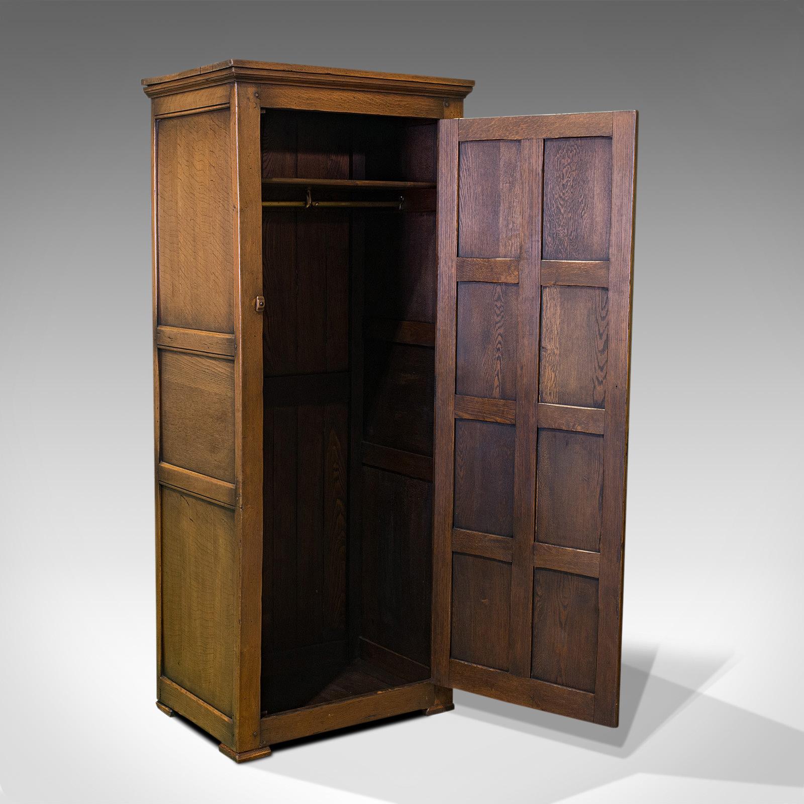 This is an antique hall cupboard. An English, Ipswich oak wardrobe or reception cloak closet dating to the Edwardian period, circa 1910.

Appealing hall or reception cupboard
Displays a desirable aged patina
Select oak shows fine grain